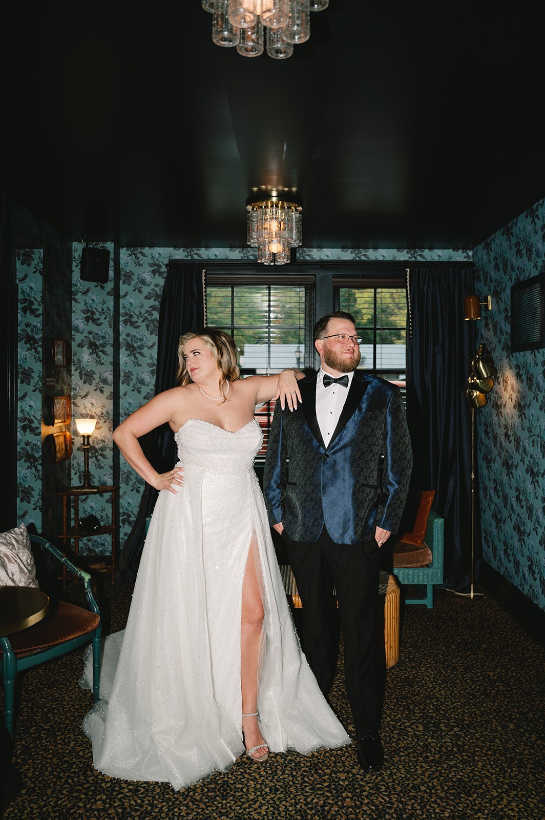 Wedding cake table with floral details, candles, and an Atlanta Braves-themed groom’s cake.