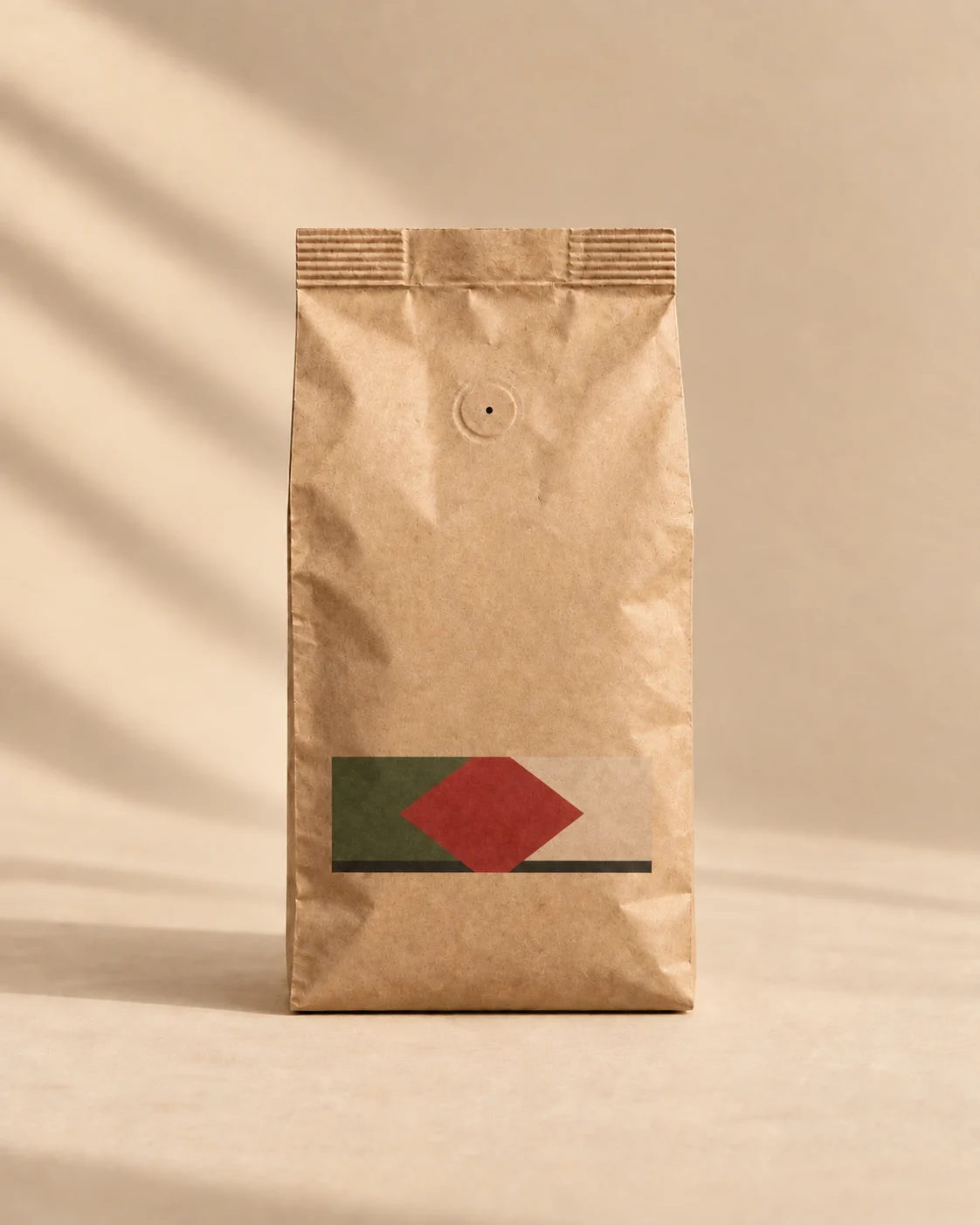 Quiet Hours Decaf, Colombian decaf coffee in a 250 g kraft bag with a red and olive chevron artwork panel