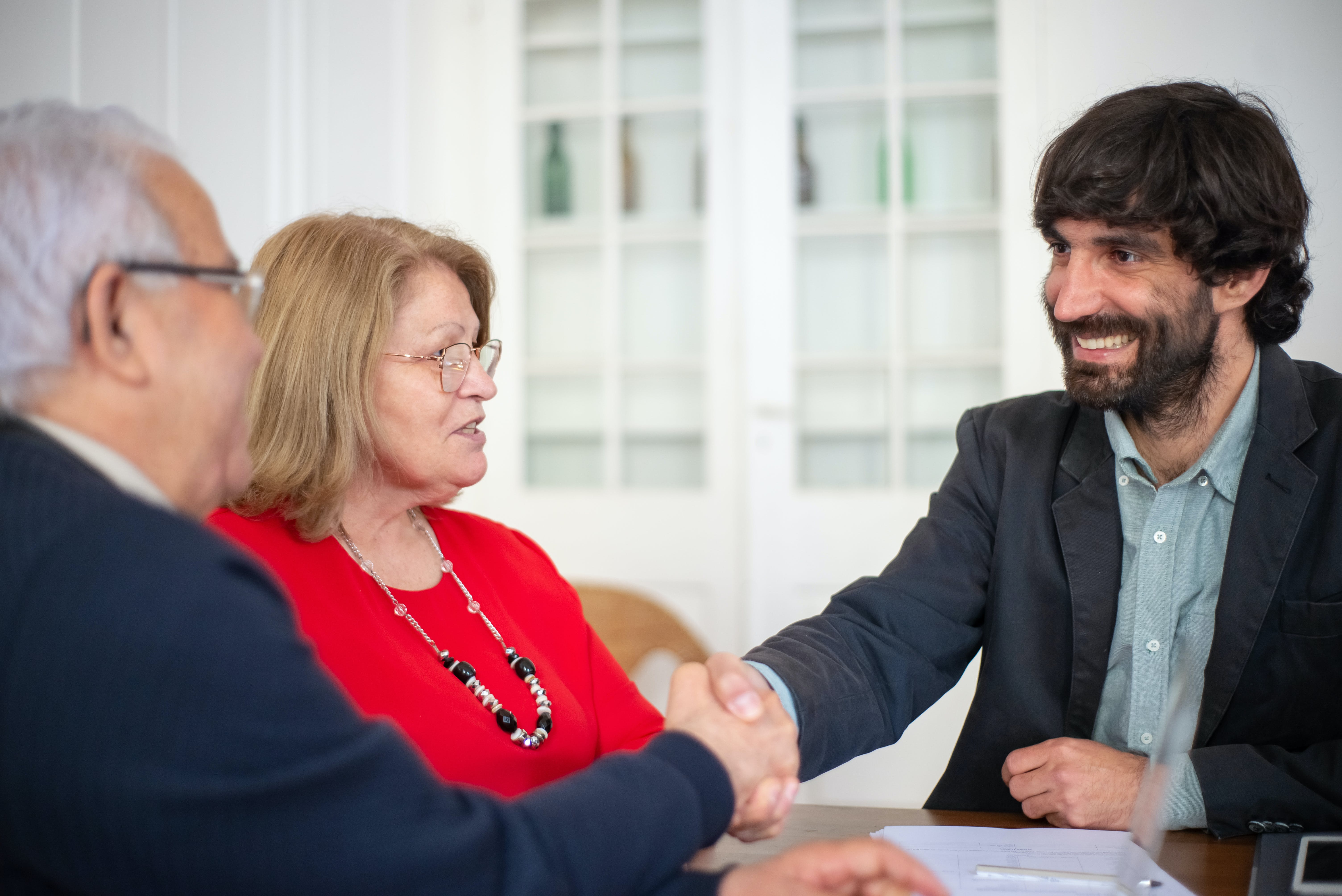 Broker doing handshake after a mortgage deal