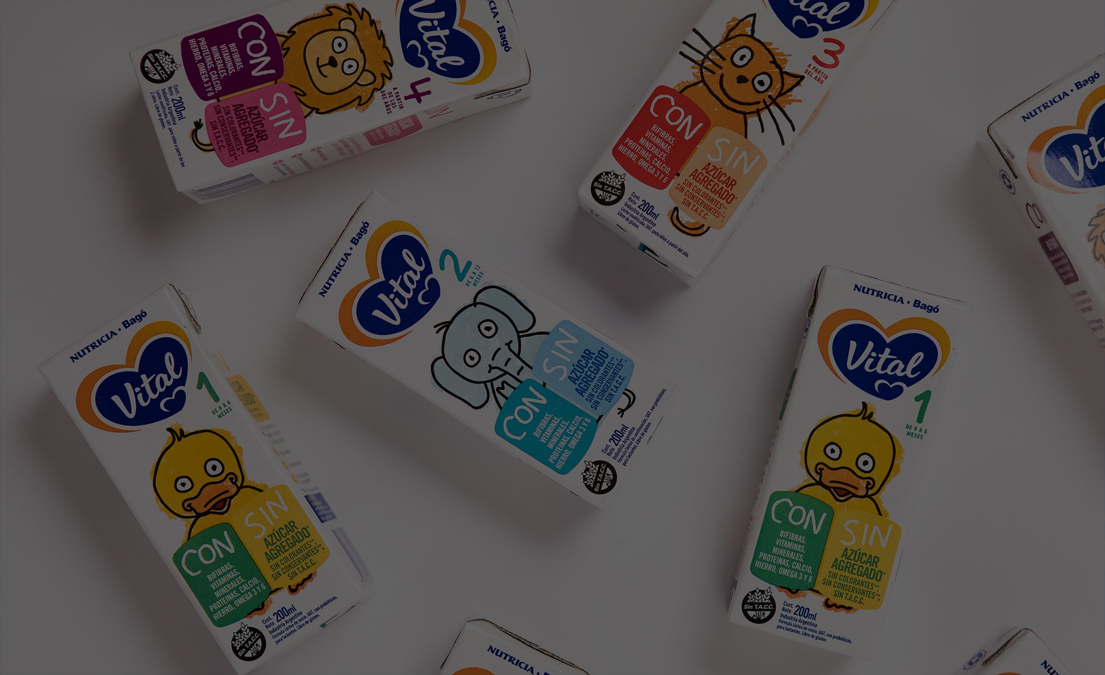 Colorful juice boxes with animal illustrations, including duck, elephant, and cat, scattered on a white background. Labels highlight "with" and "without" options. Playful tone.