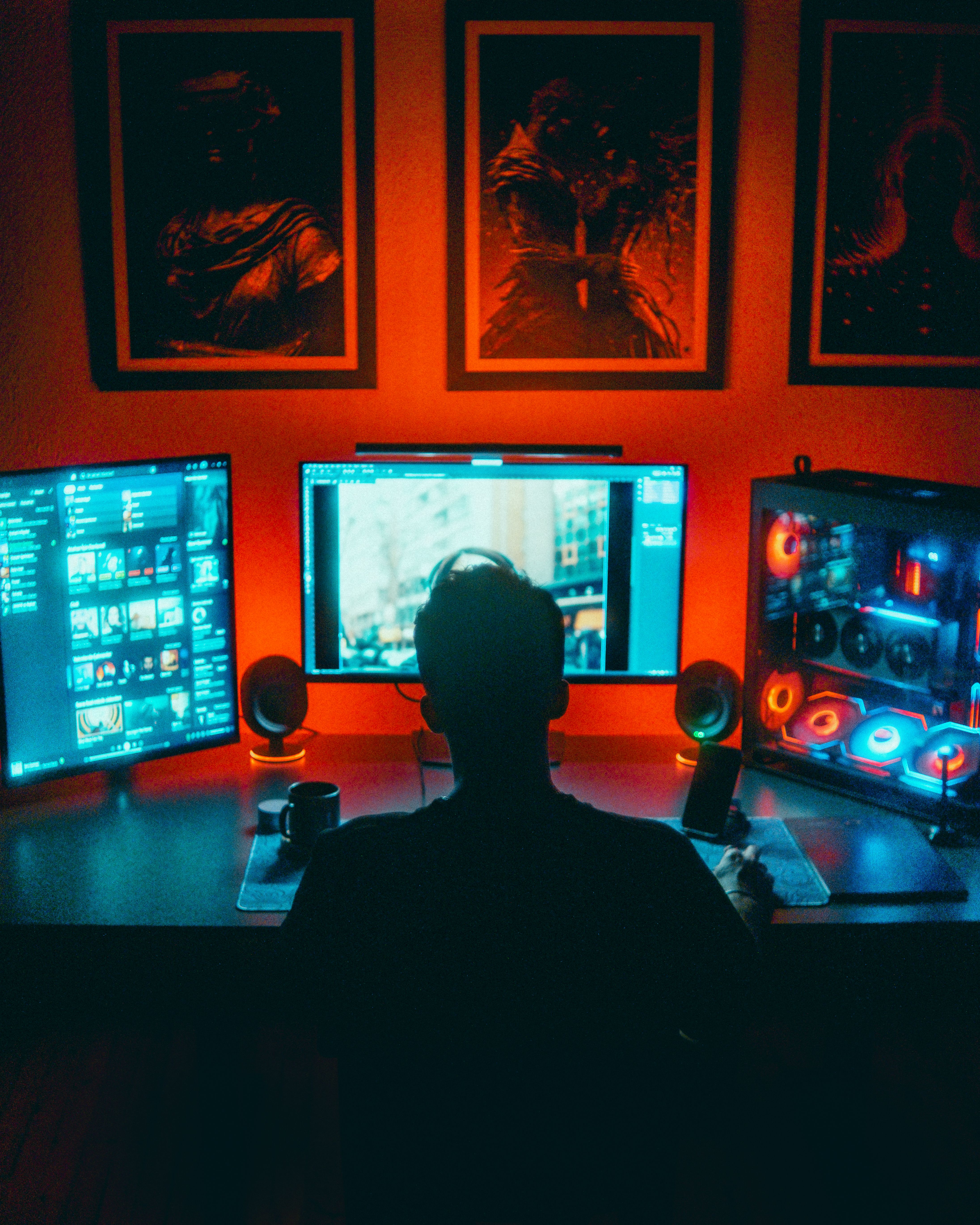 silhouette-of-a-gamer-at-a-dual-monitor-setup-illuminated-by-neon-lights,-creati - umut-🆁🅰🆆 (pexels)