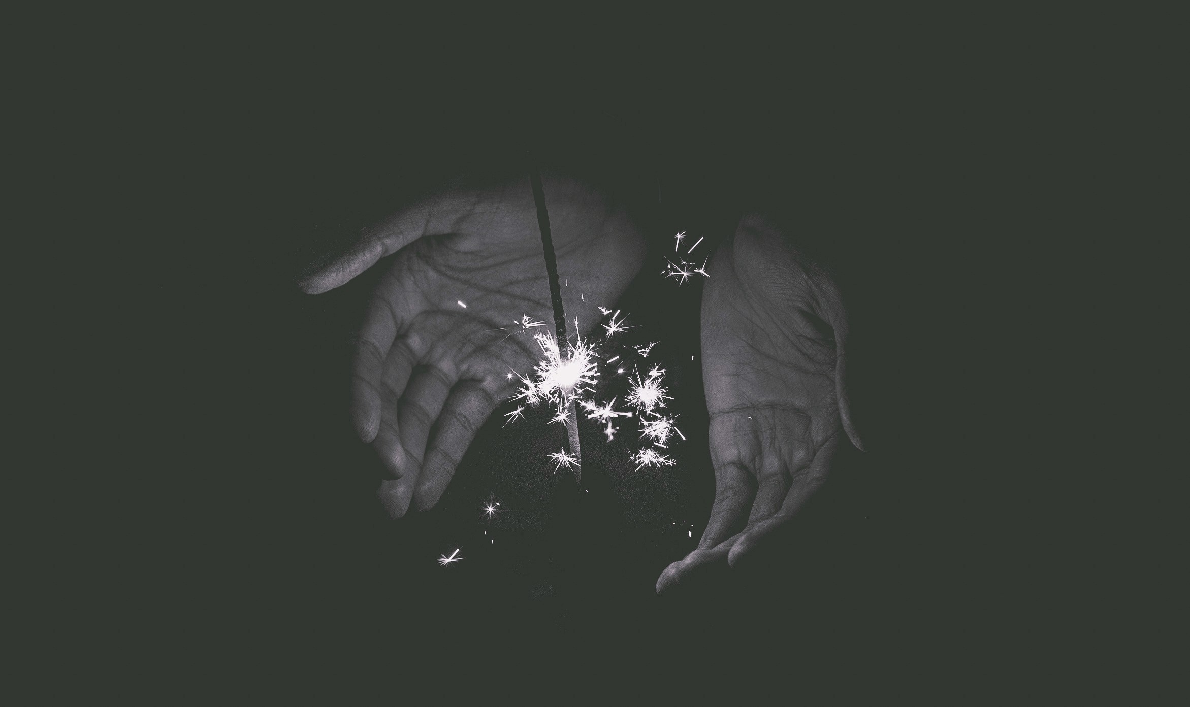 Hands cupping a sparkler