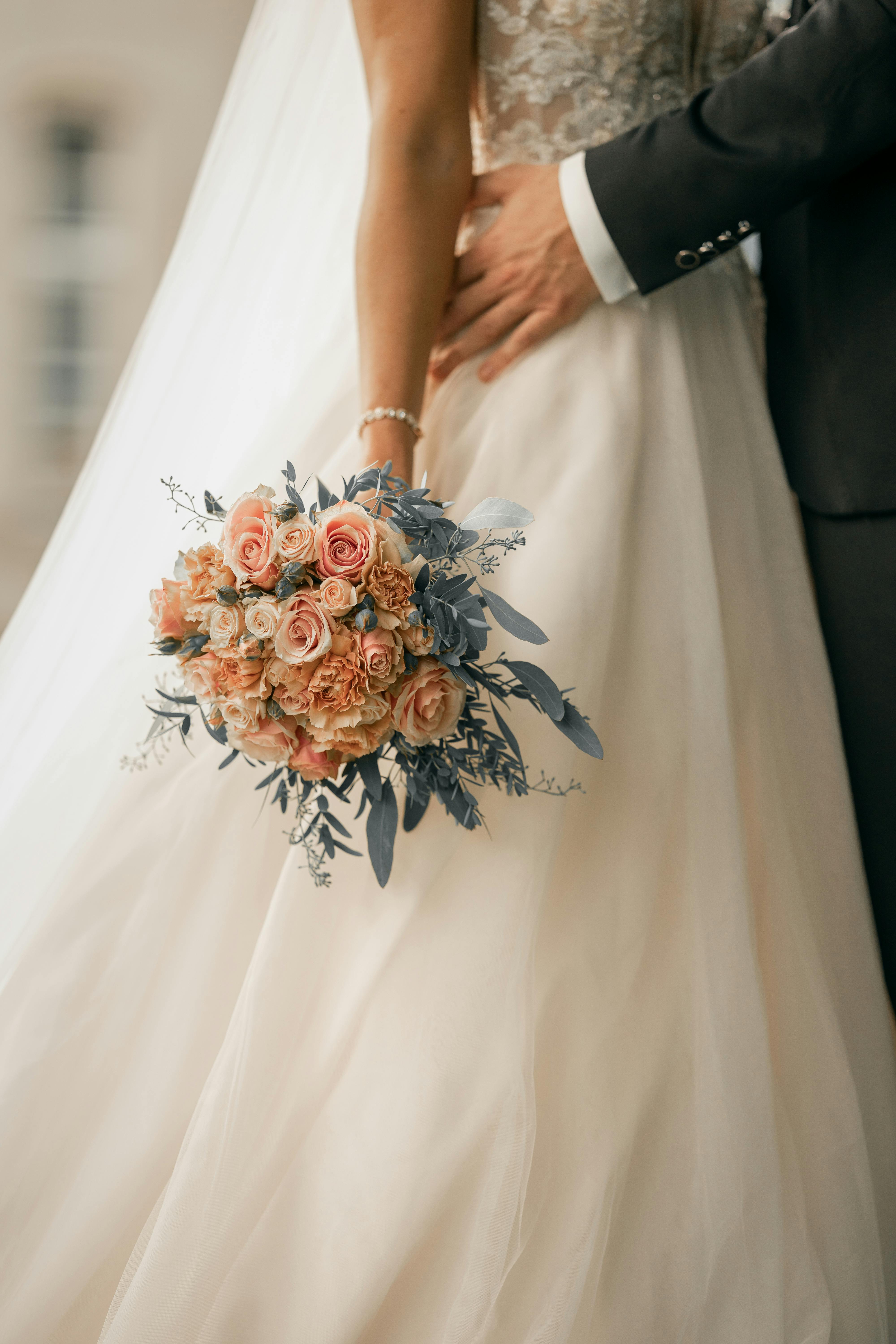 A joyful couple stands together.