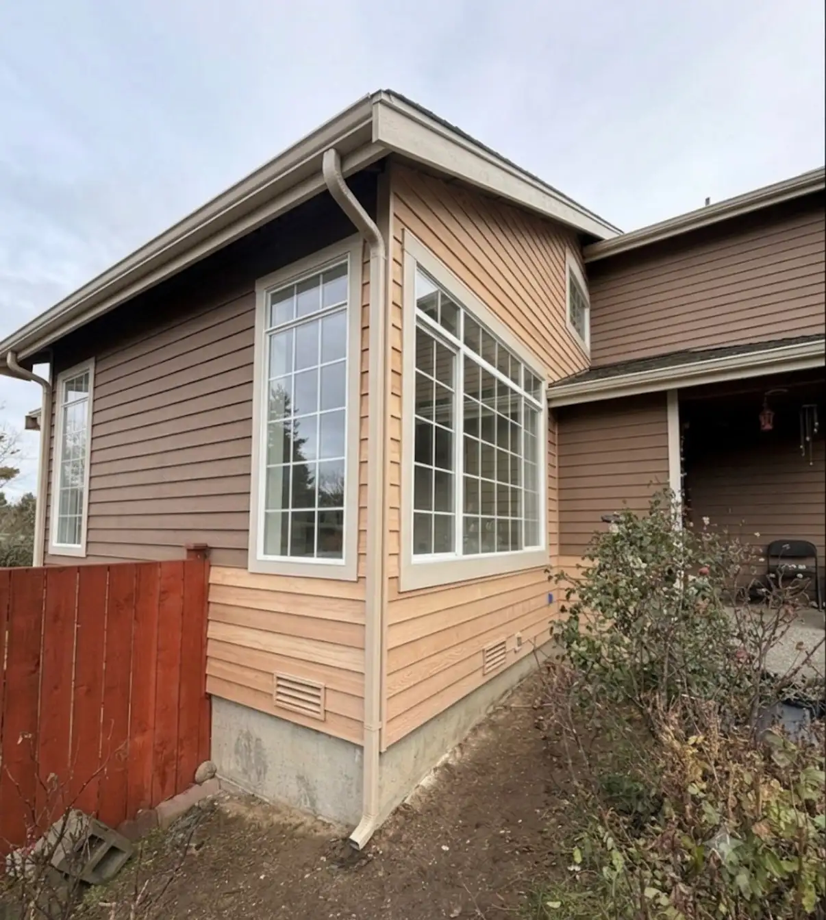 Weathered siding and trim in need of exterior repair