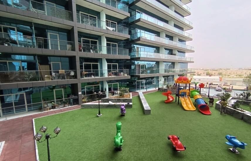 Playful children's area with colorful equipment. Real estate agent listings.