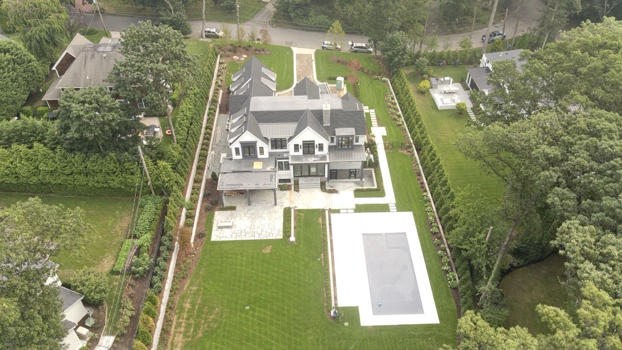 Aerial view of a Hamptons home with pool by Bonilla Irrigation & Contracting, Long Island NY