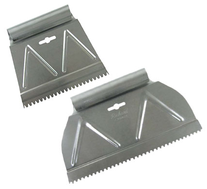 Two varying-sized adhesive spreaders used to apply the backing to AGL Grass North artificial grass.
