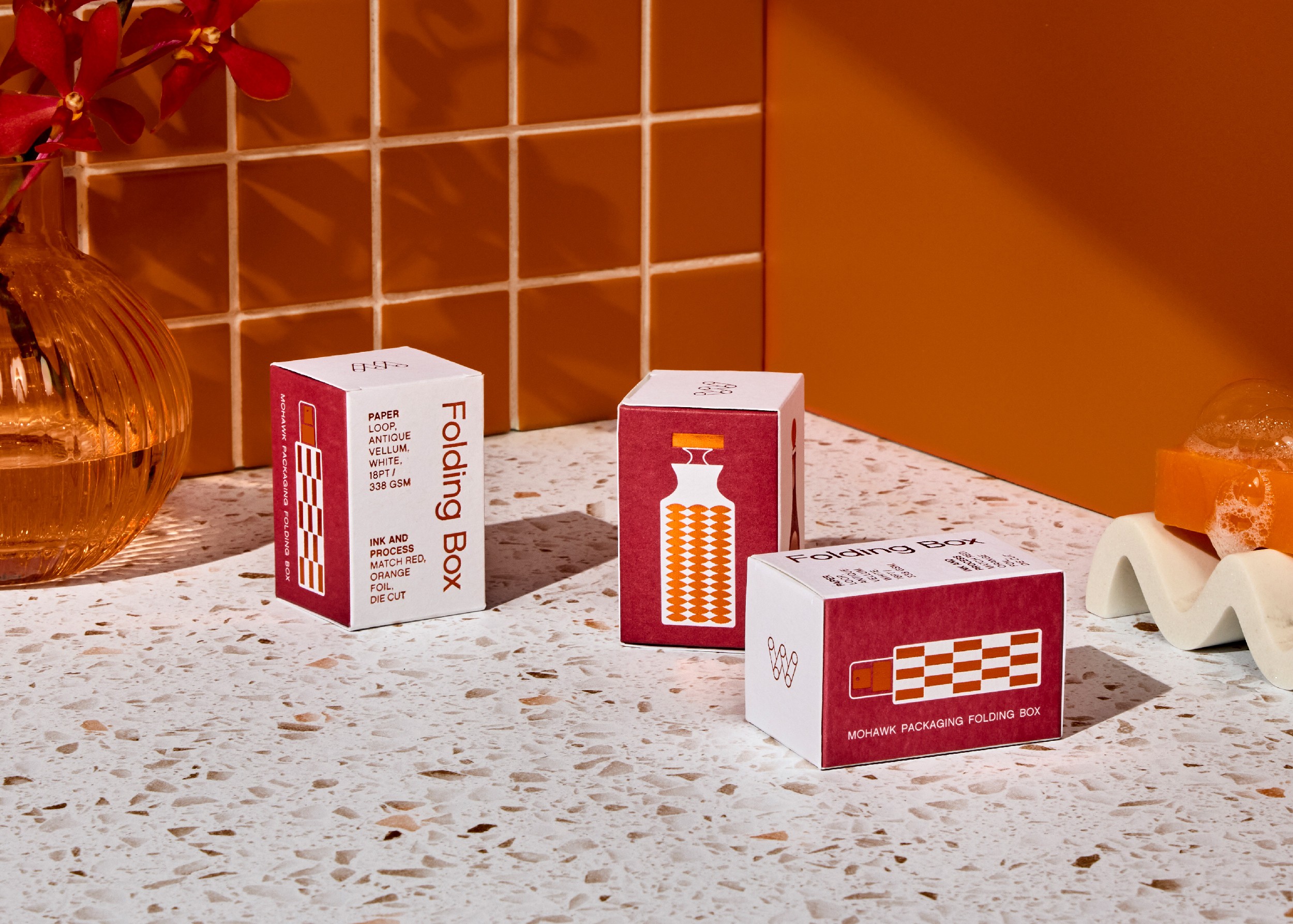 Streetside billboard with flyposters of the Batch.Works brand and illustrations