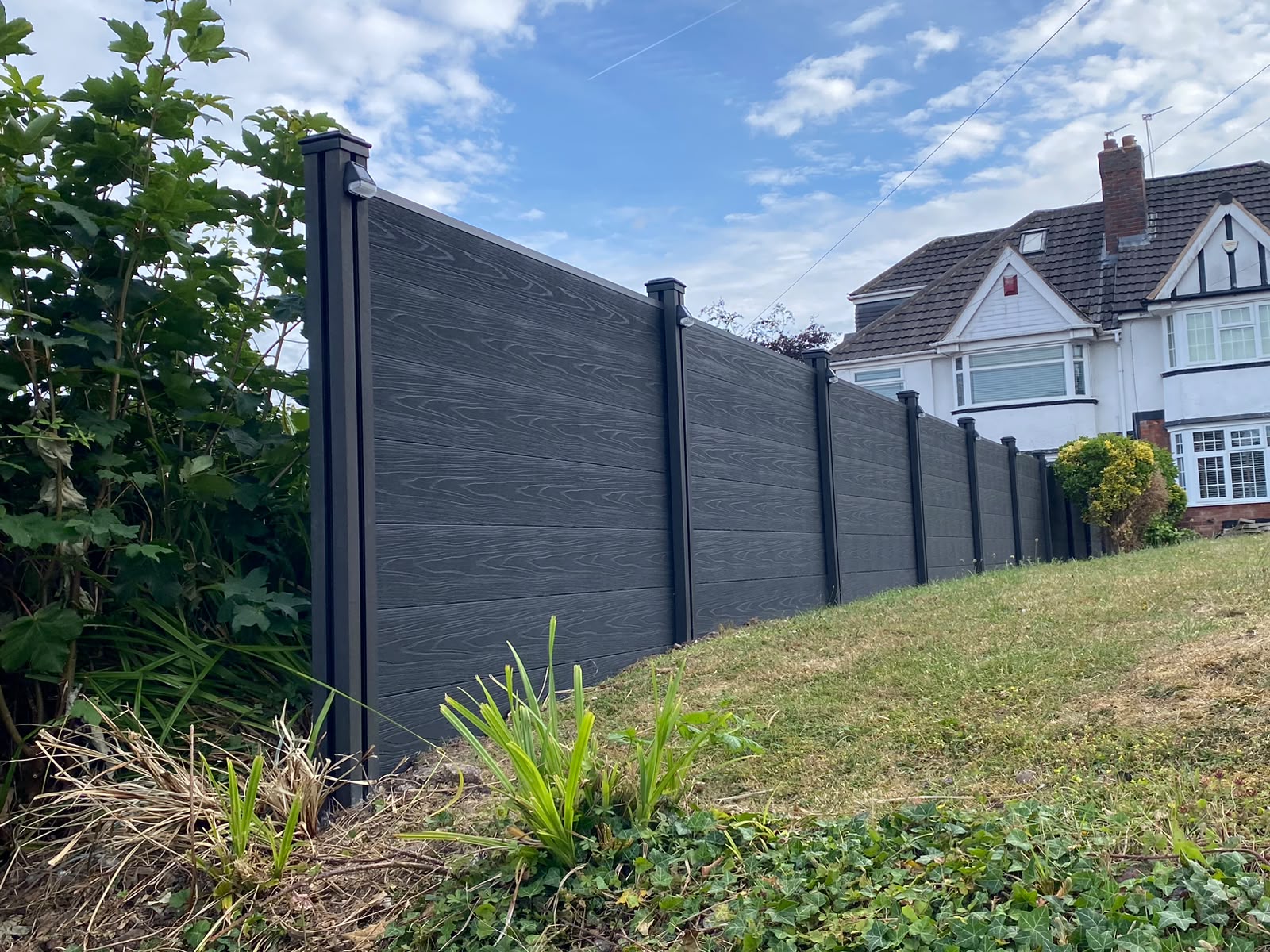 Weathered timber fence before replacement