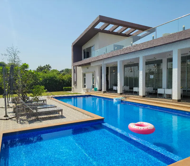 white concrete building with swimming pool