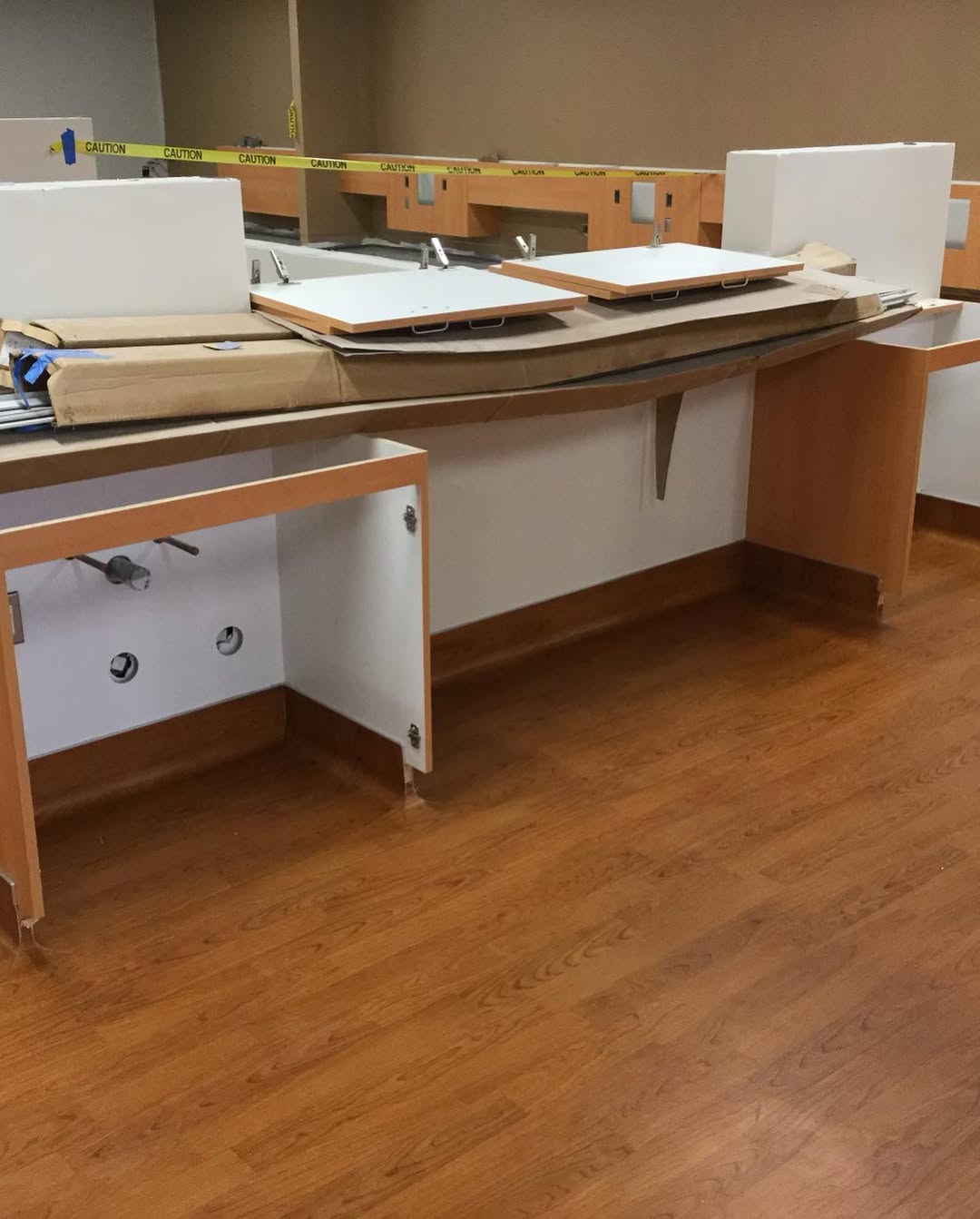 Finished wood-look sheet vinyl floor at a casework run