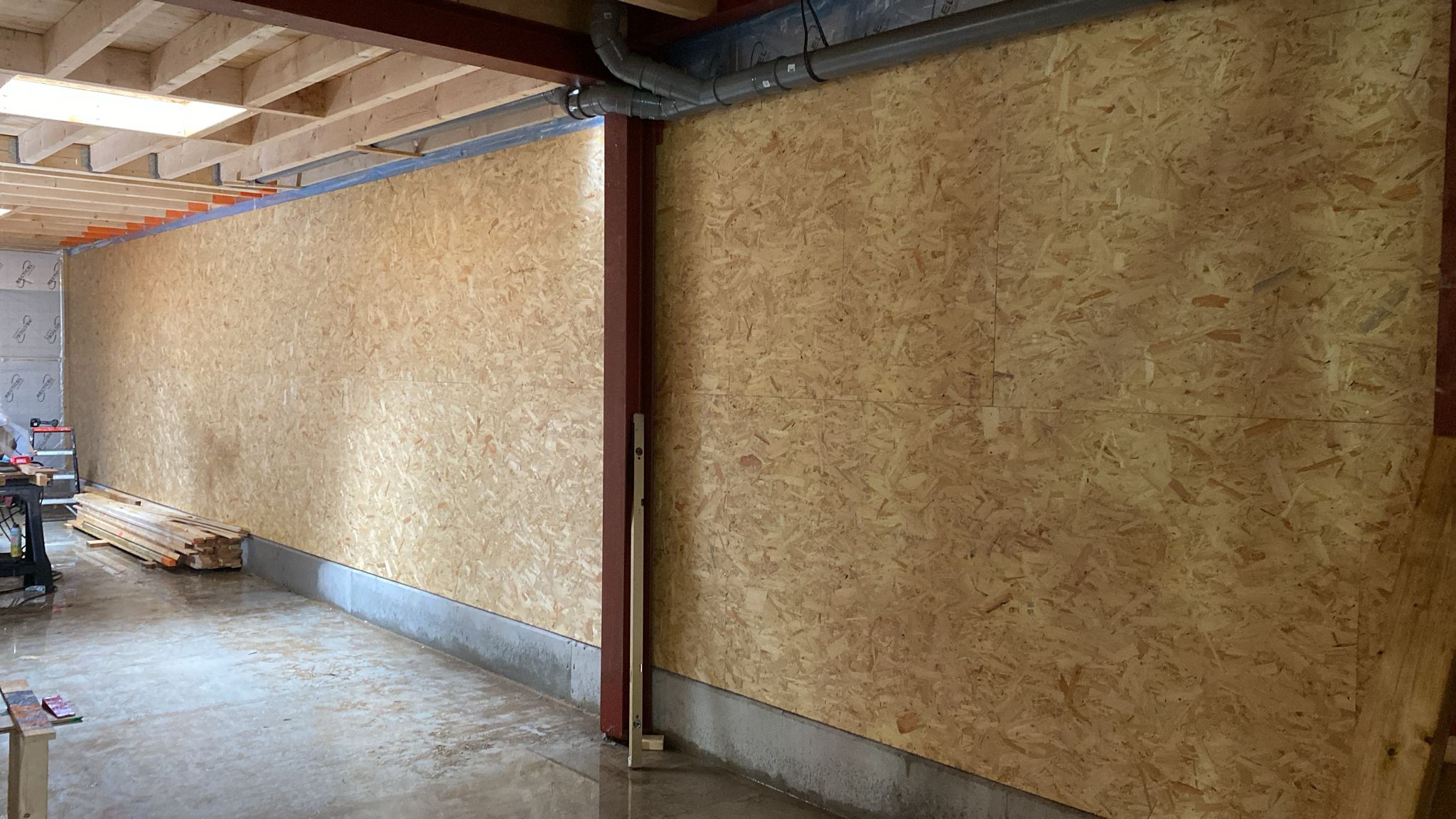 white wooden shelf near white wall