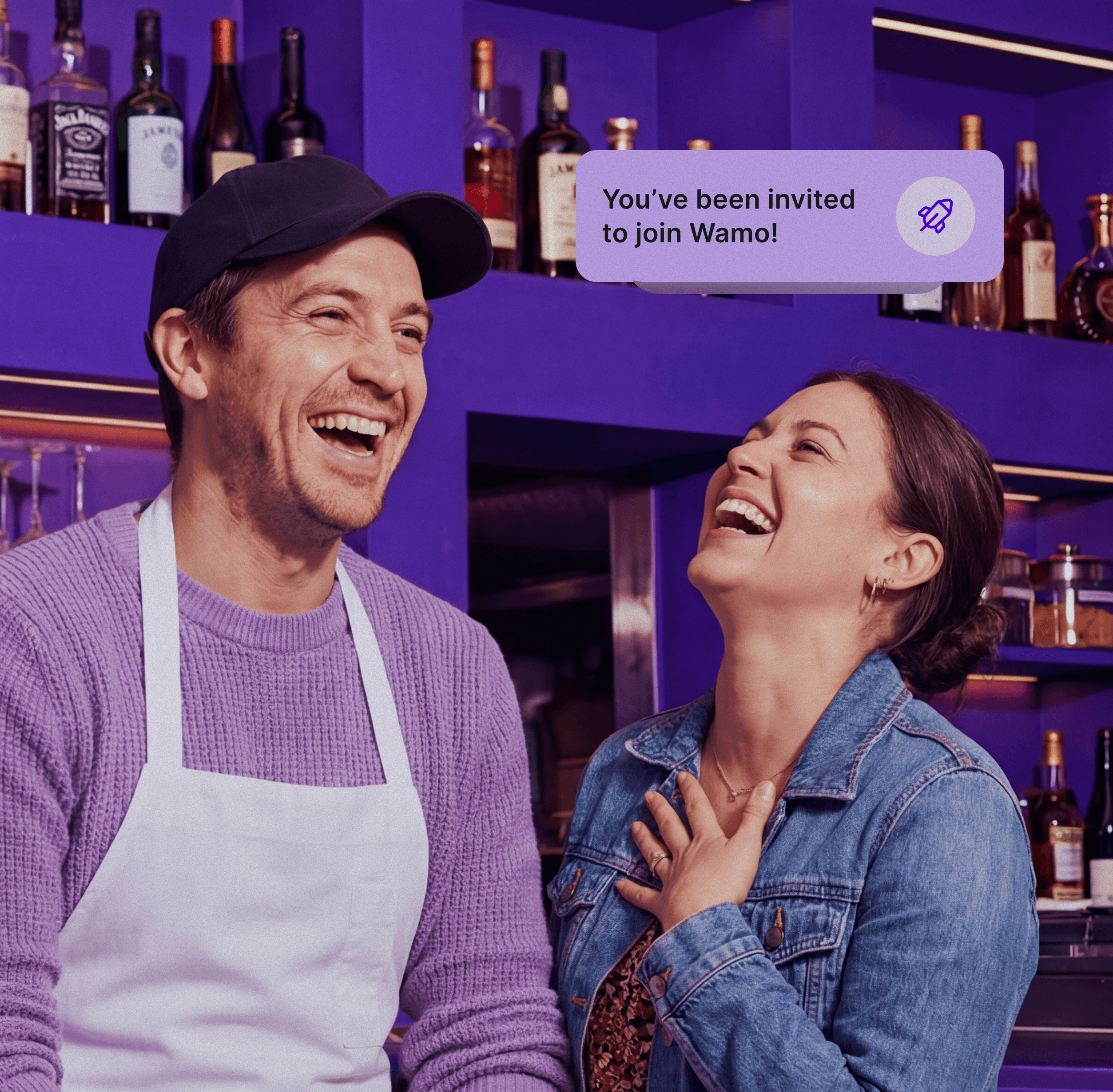 A desk with a laptop and an employee badge laying on top of it.