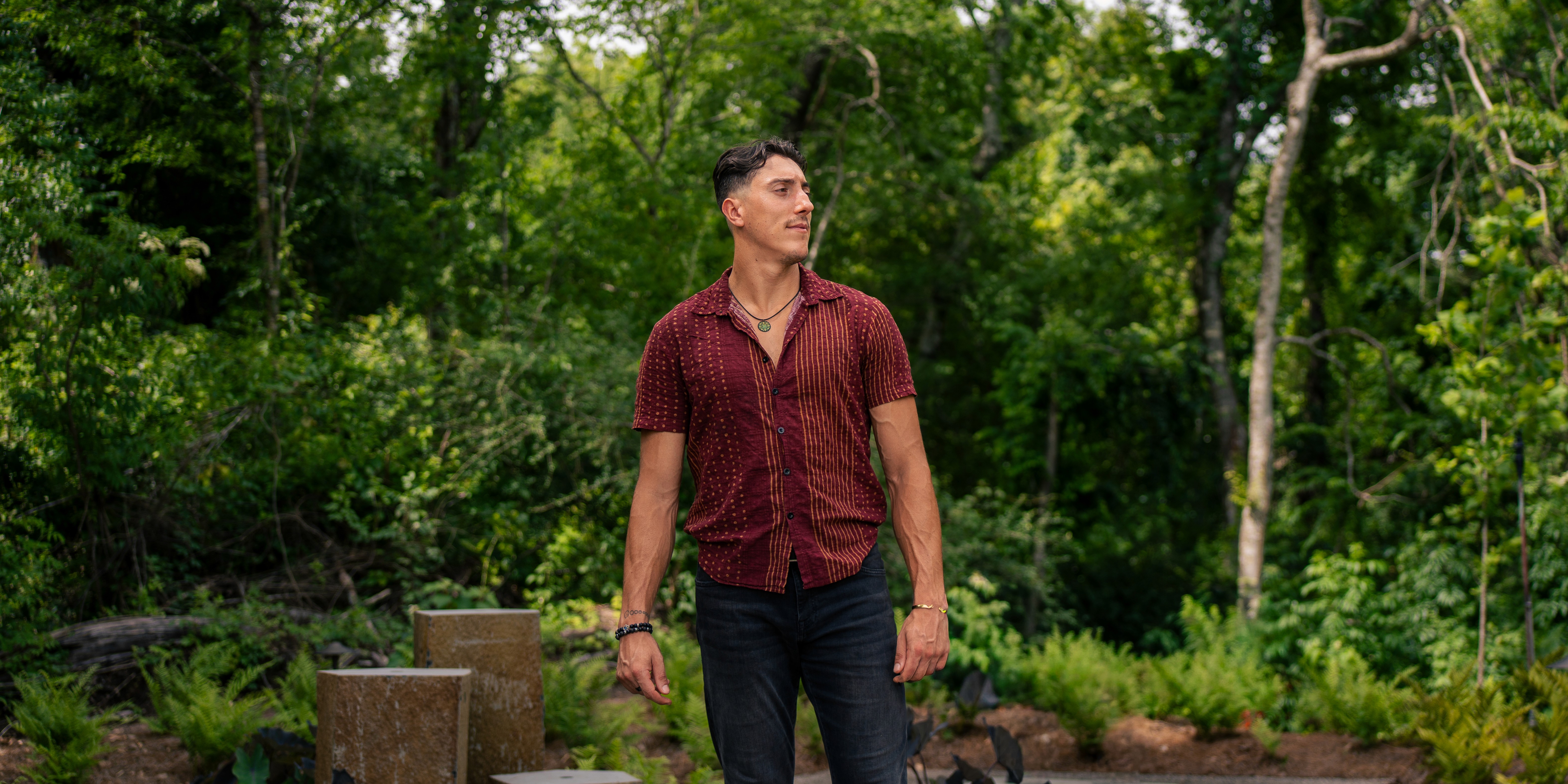 Reese LeBlanc somatic coach standing in forest