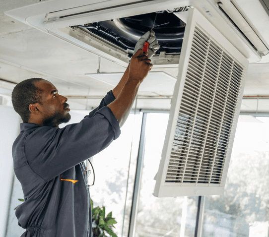 HVAC technician performing professional duct cleaning in a Mississauga home to improve airflow, remove dust buildup, and enhance indoor air quality.