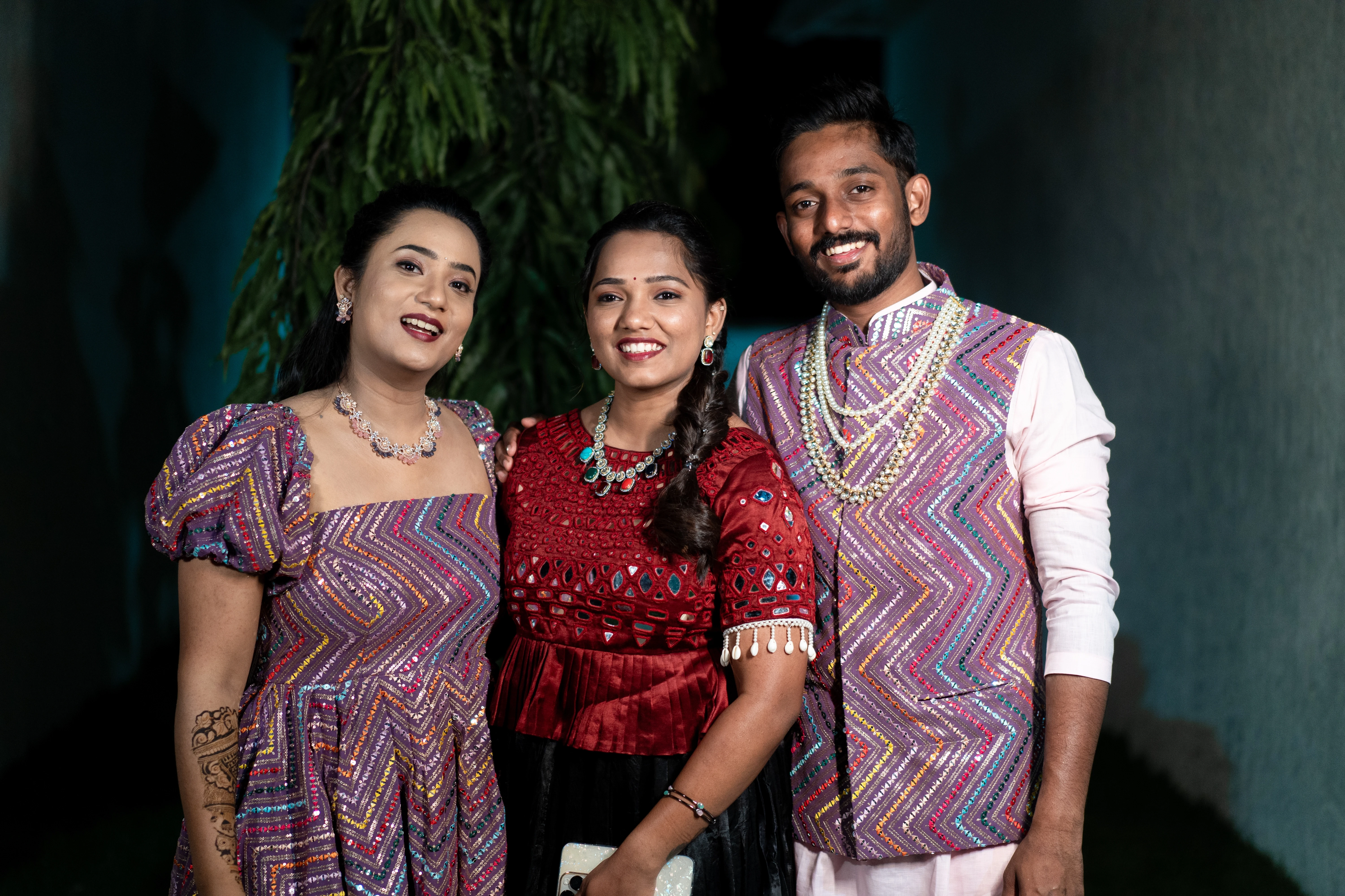 A cheerful photo of Vishwani with her family, all dressed in beautiful traditional attire, capturing a special moment. Photo by Out of The Blues Fine Art Wedding Photography in Hyderabad.