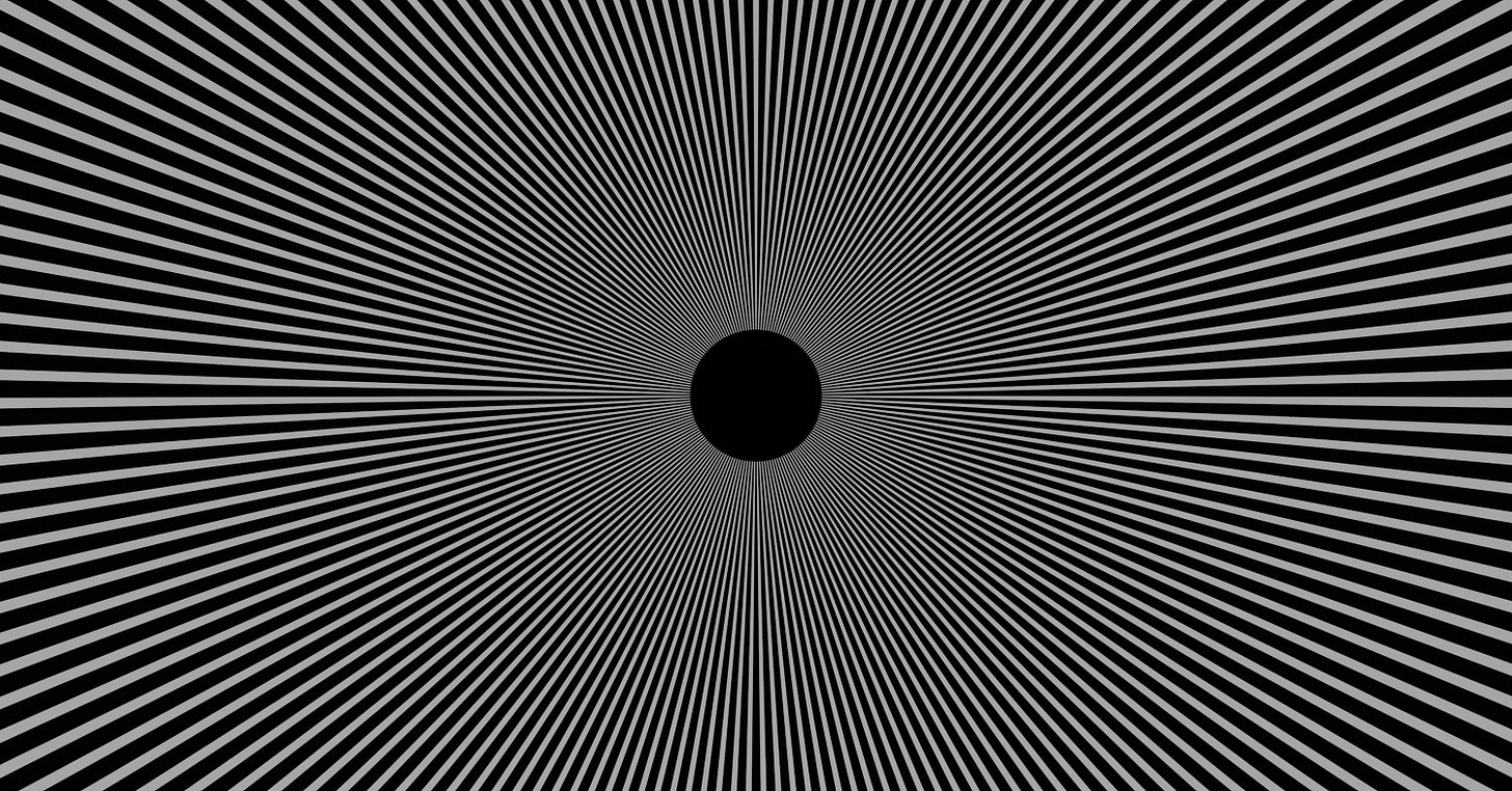 a black and white image of a black hole