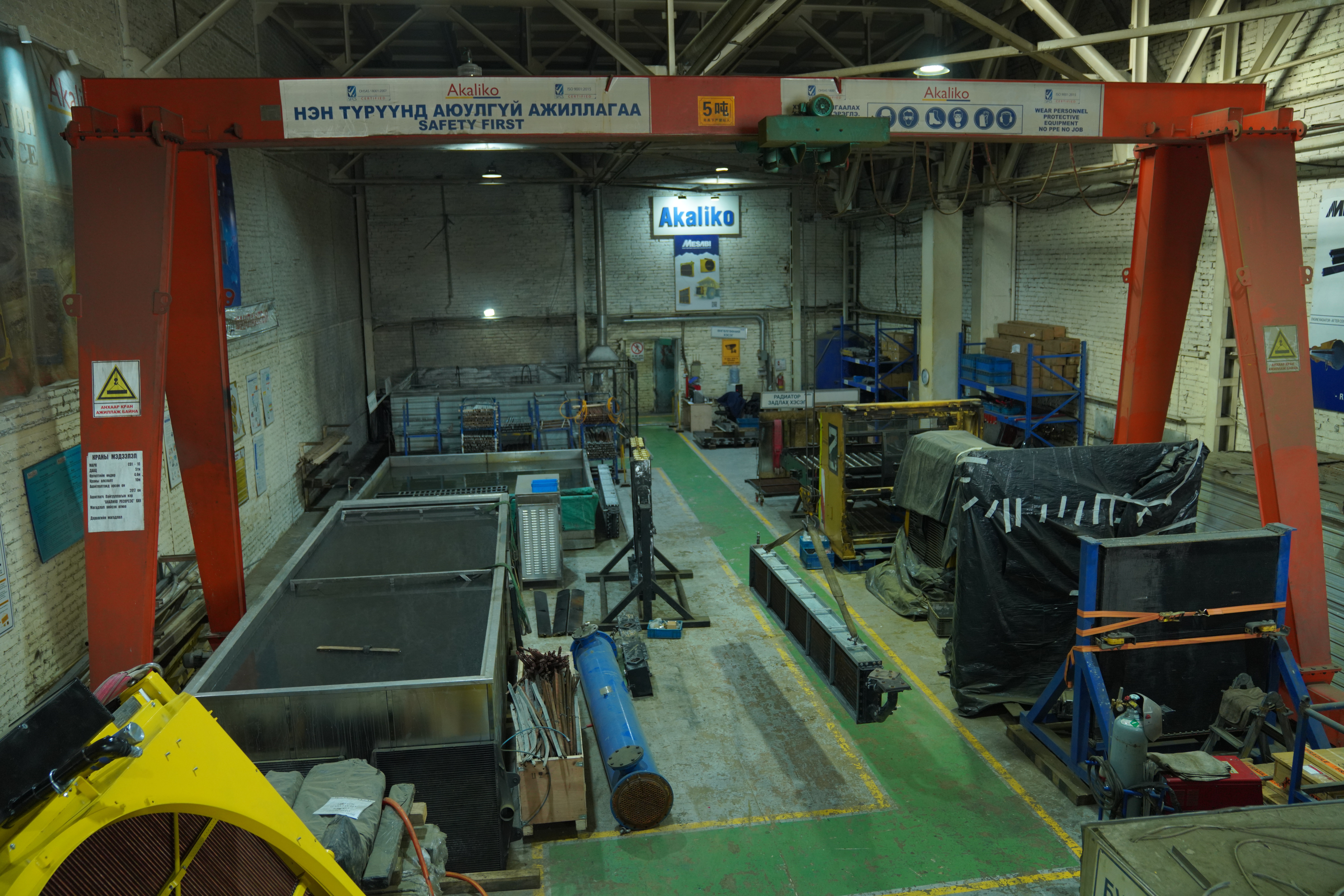 Top-down view of wind turbine over dry terrain with adjacent building