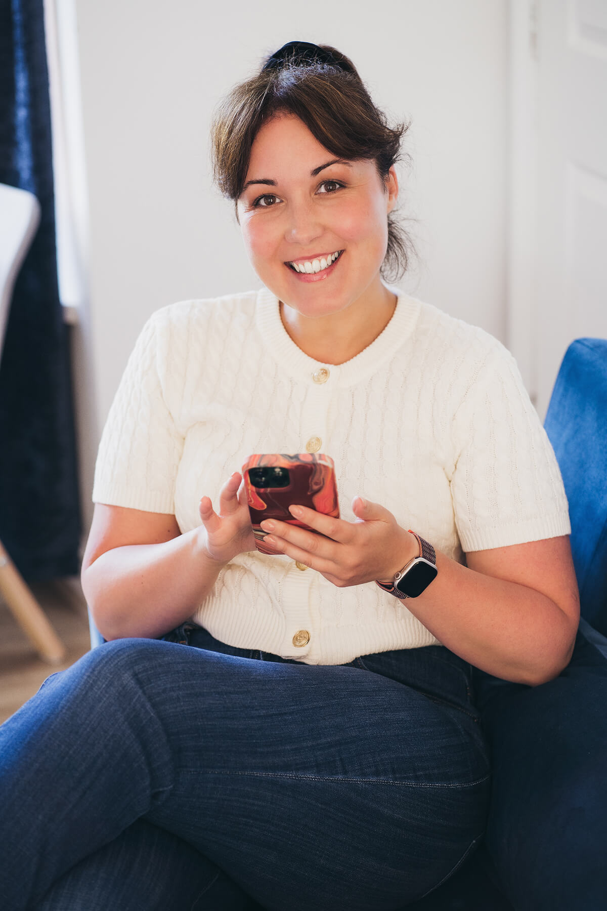 Aniko Rucz smiling while replying to messages about short-term rental hosting support