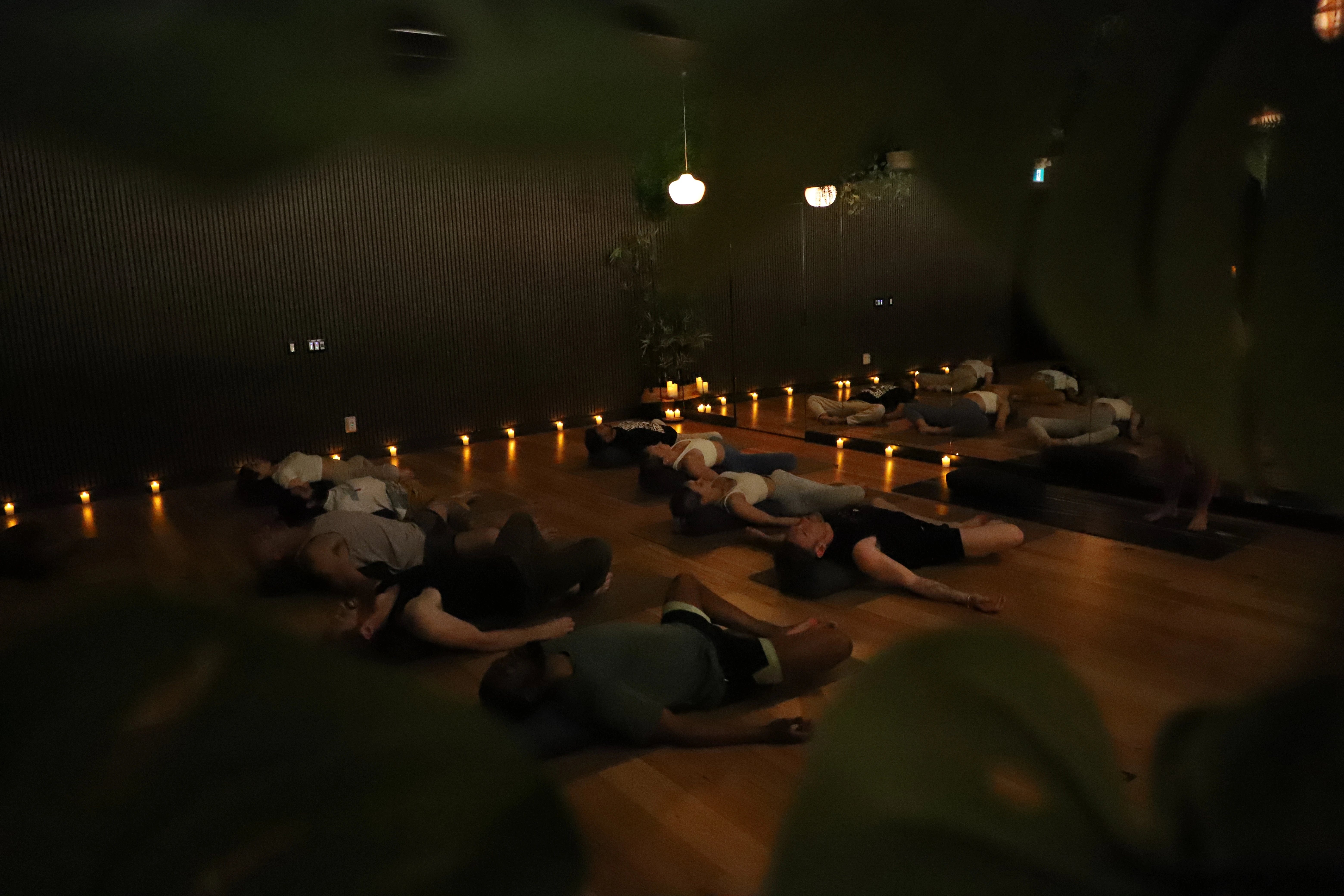 a group of students laying on yoga mats
