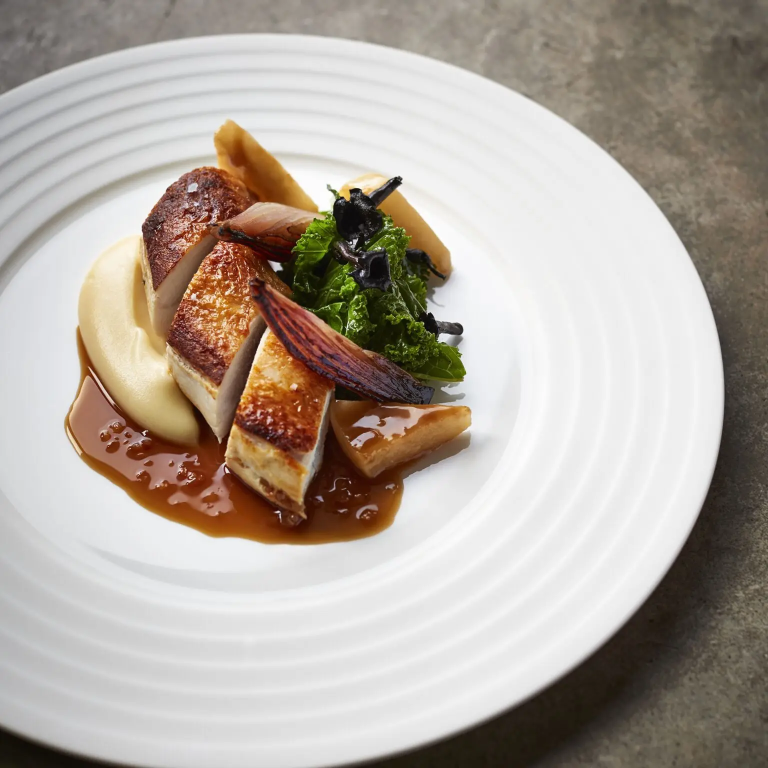Roast chicken with greens and purée served at Trivet restaurant near the Menier Chocolate Factory, a Michelin-starred dining spot in Southwark.