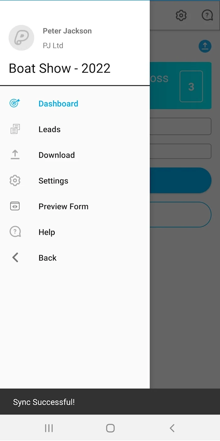 a hand holding a black device
