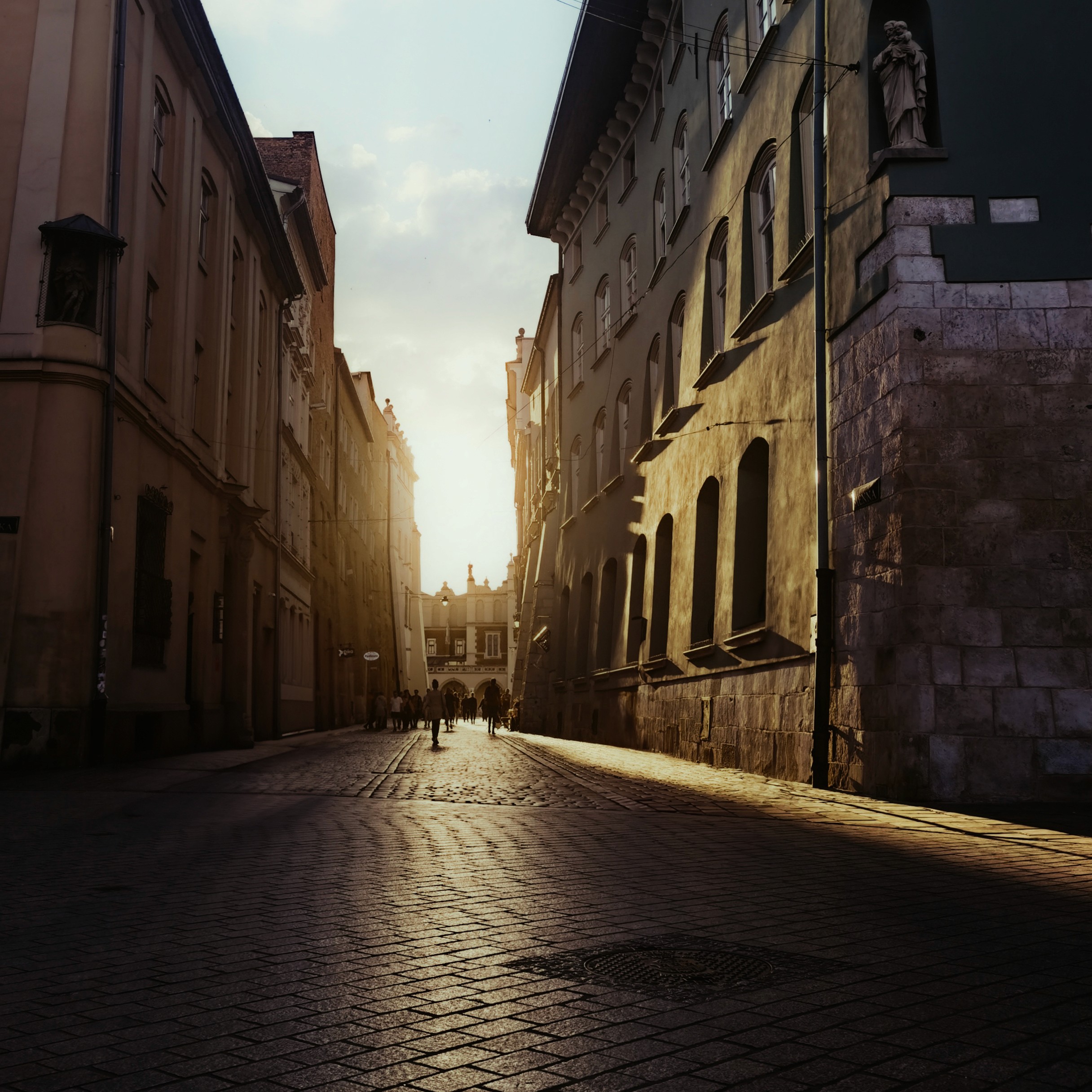 Person sitting on a ledge overlooking New York City skyline
