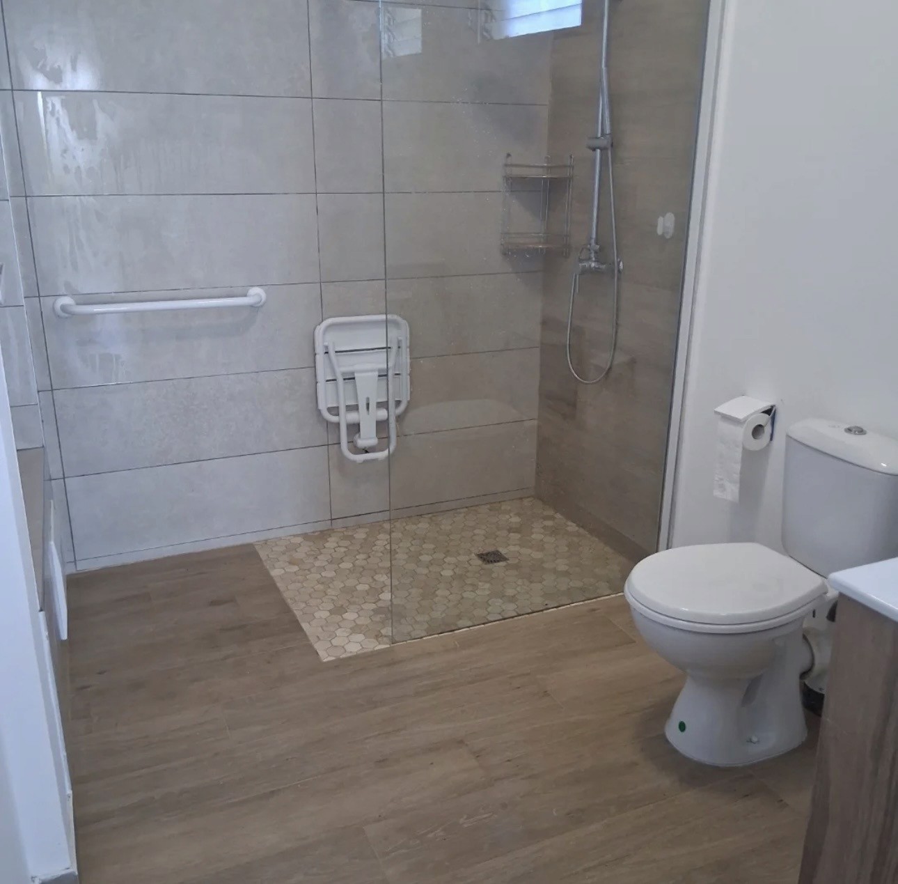 a bathroom with a toilet, sink, and bathtub