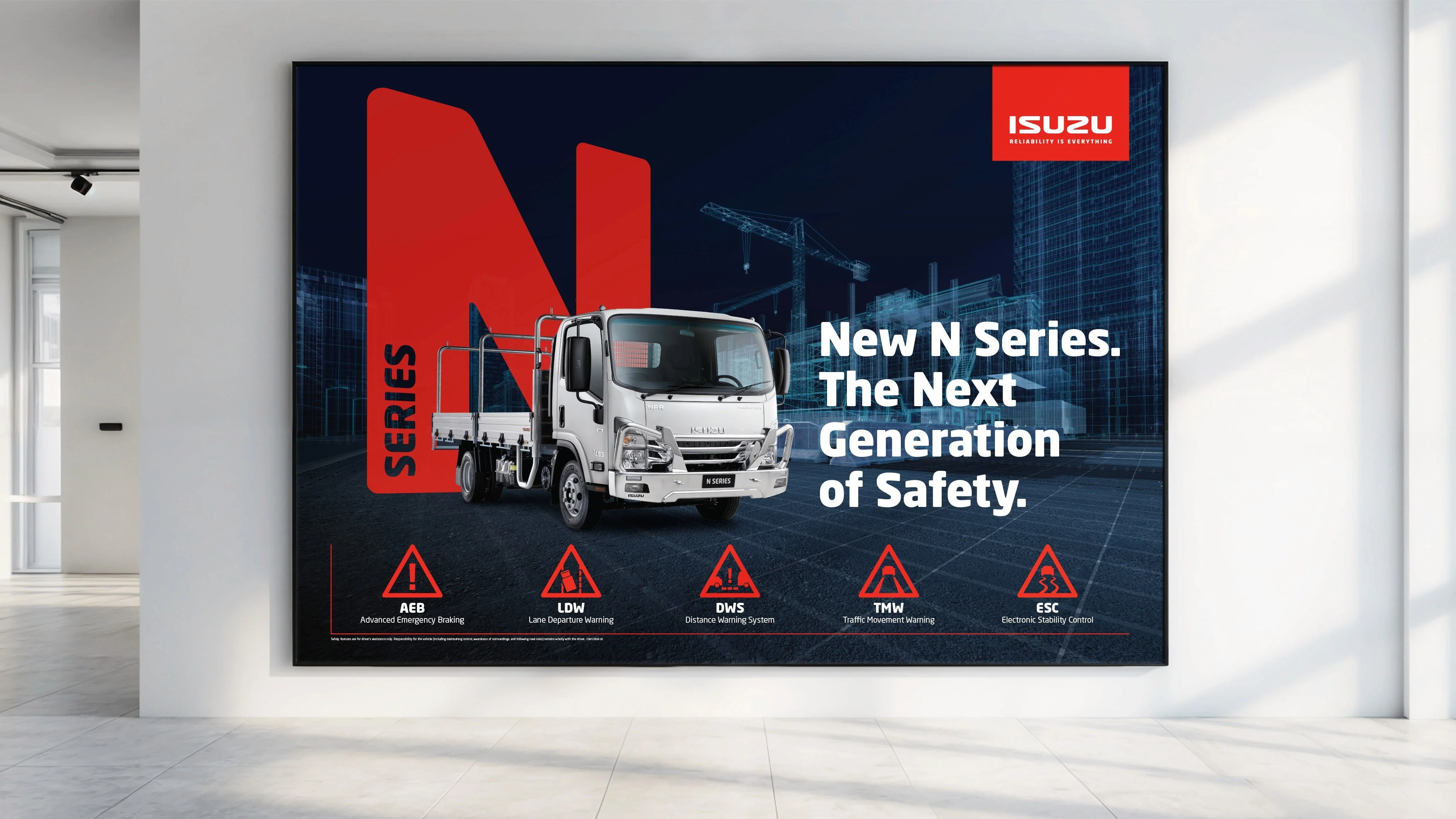 Isuzu poster: 'New N Series. The Next Generation of Safety.' with a white truck and AEB, LDW, DWS, TMW and ESC safety icons