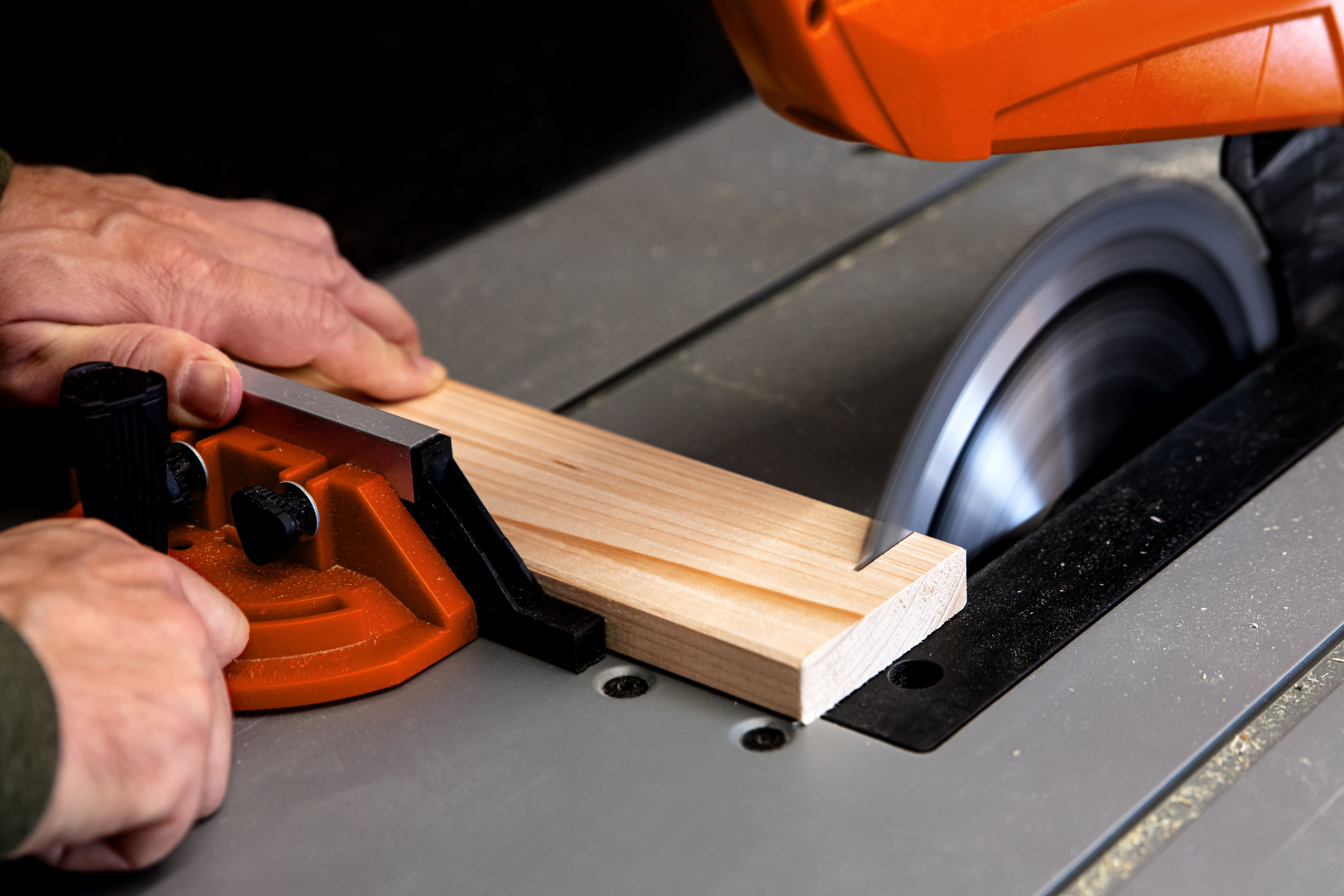 A man operating a woodwork cutting machine to saw wood, showcasing precision and efficiency by Automech