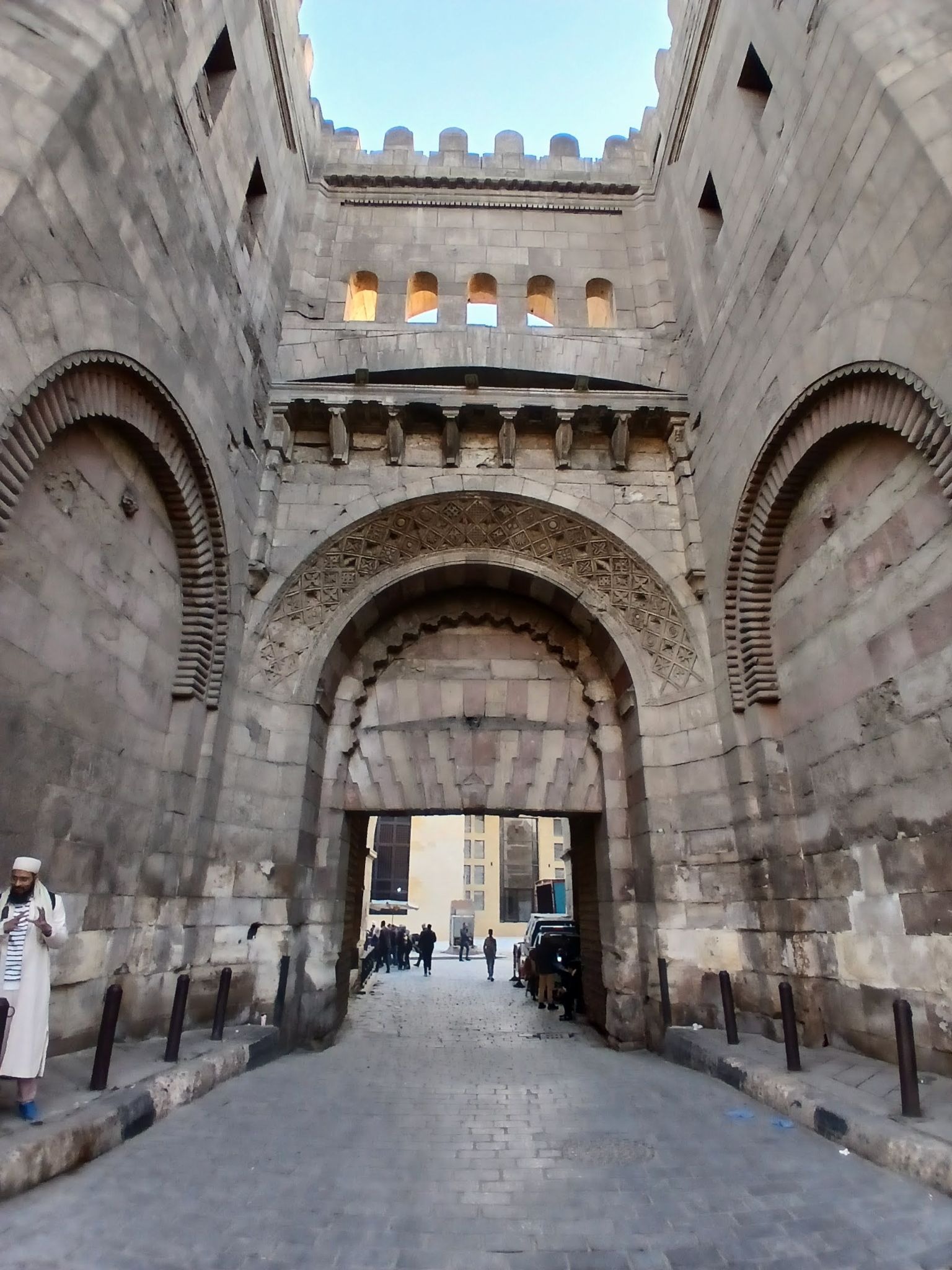 An image of one of a large gate, one of Fatimi Cairo. The gate is decorated with carvings and symbols from Fatimi times.