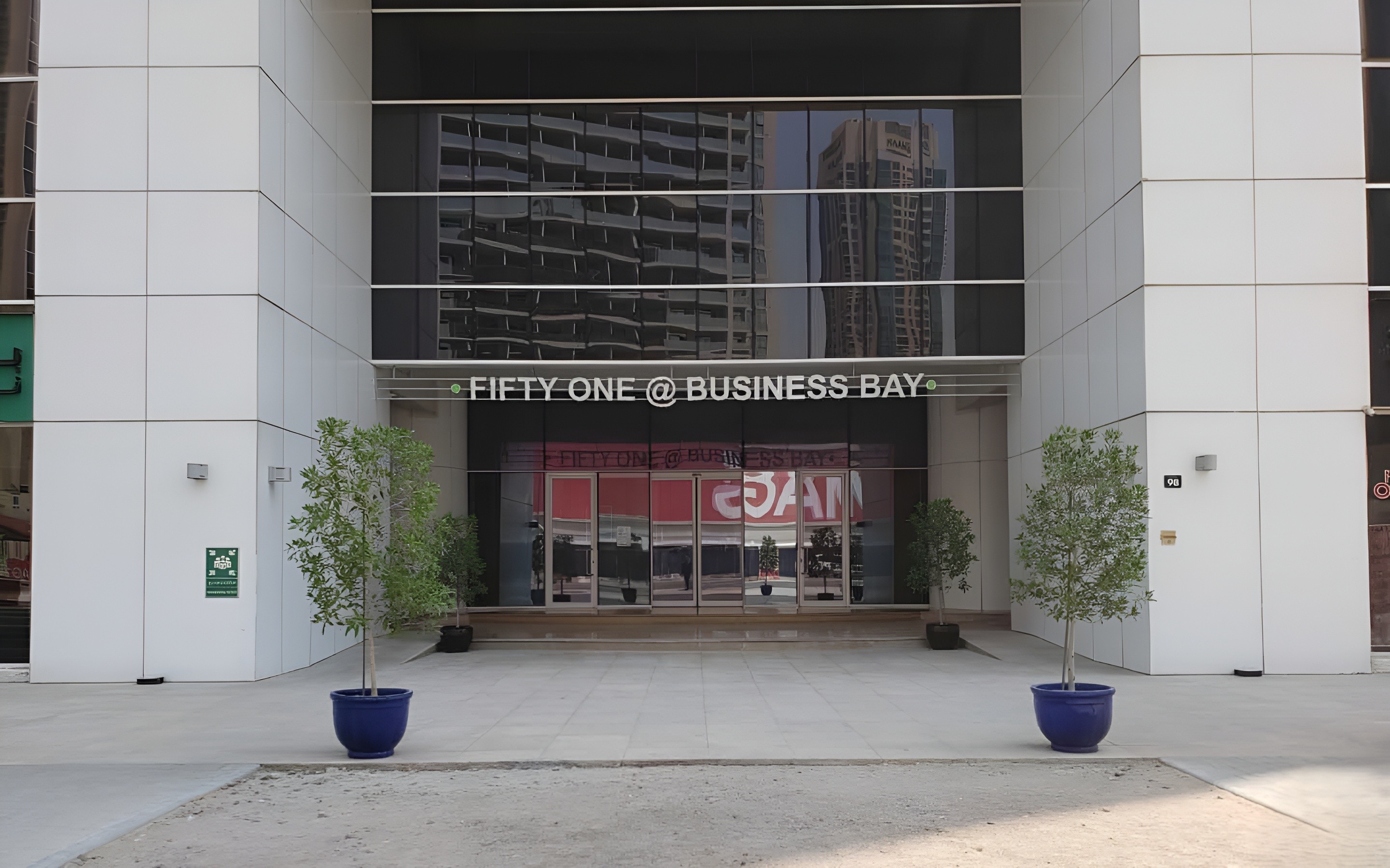 Rear of Fifty One Tower showing ample parking. Excellent commercial accessibility in Business Bay. Agent listing.