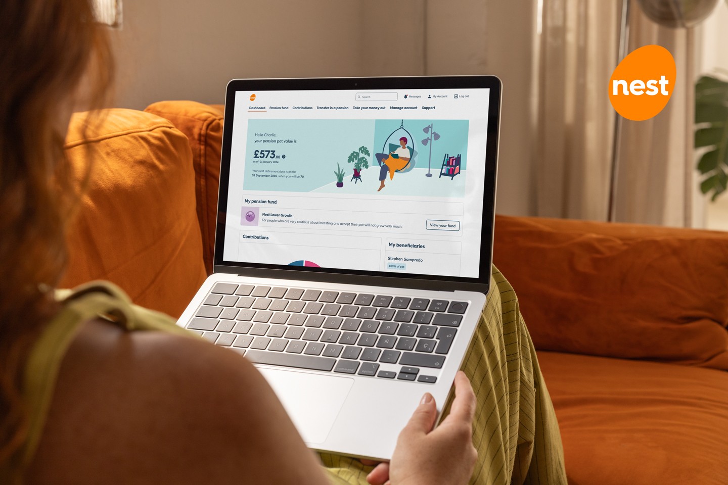 Image of a Nest member viewing their pensions dashbaord on a laptop as they lay on a sofa with the Nest logo in the top right of the image