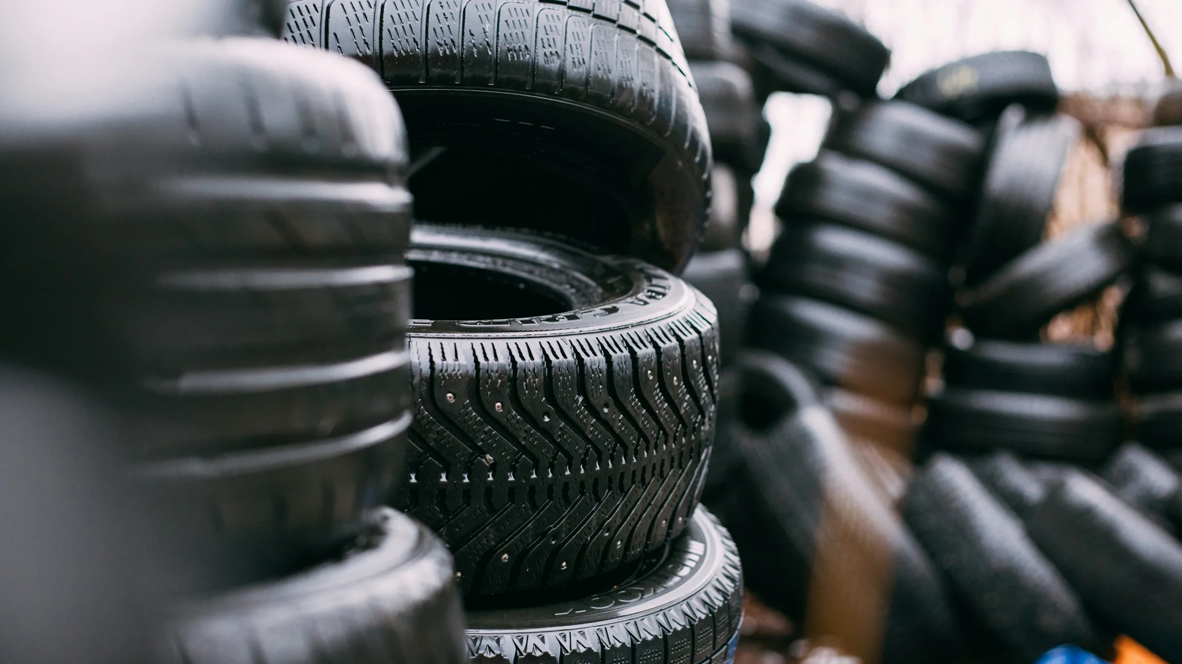 Stacks of new and used car tires, a major use of carbon black
