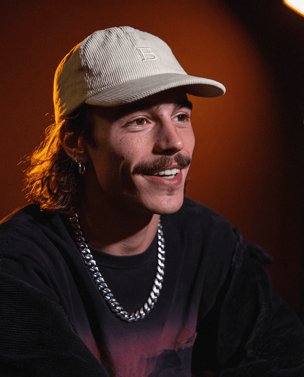 smiling man in cap