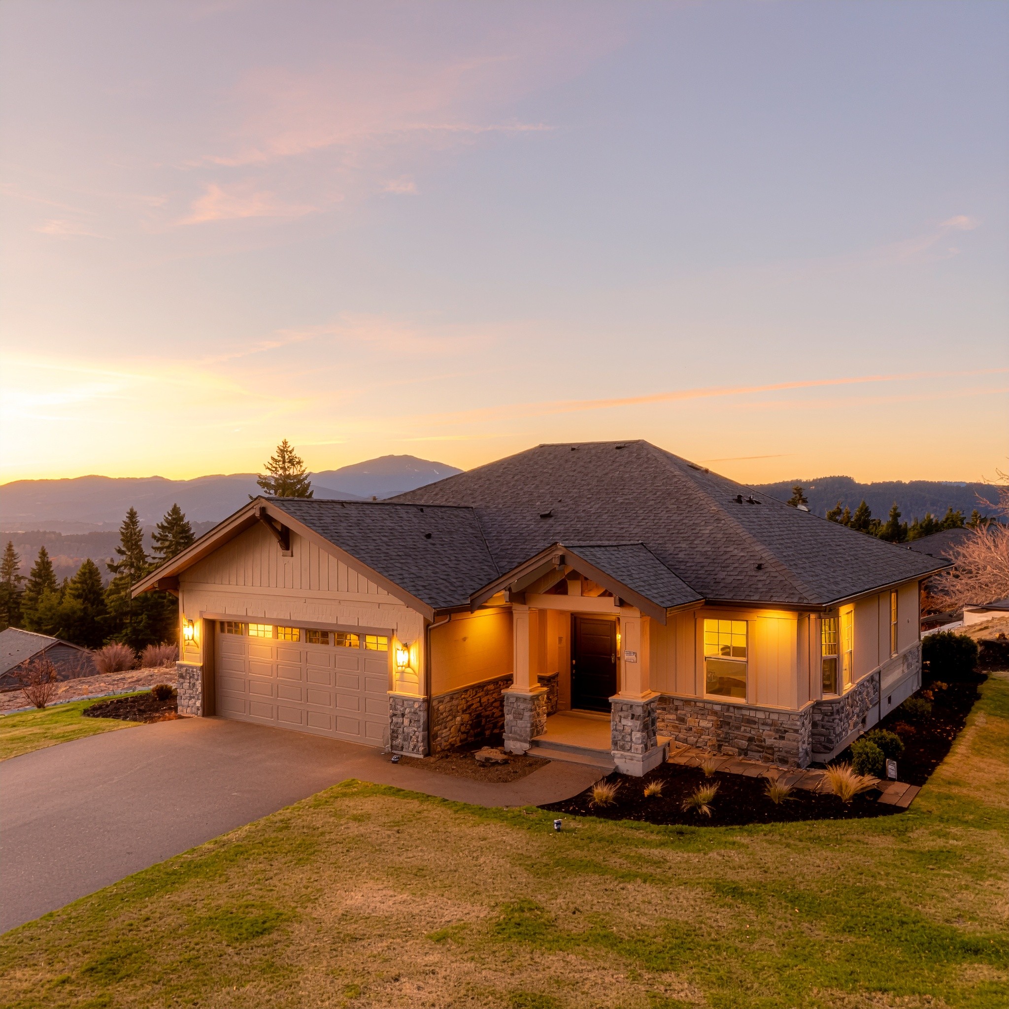 Sunset aerial photo of craftsman home with new roof in East Medford hills