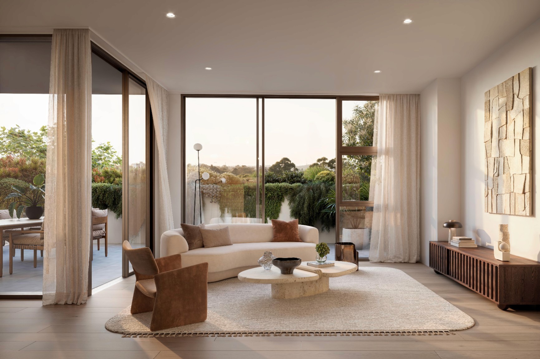 Open-plan living area with balcony and greenery in Falcon and Alexander off the plan Sydney apartment