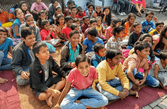 Group Of Kids Smiling and Listening Intently