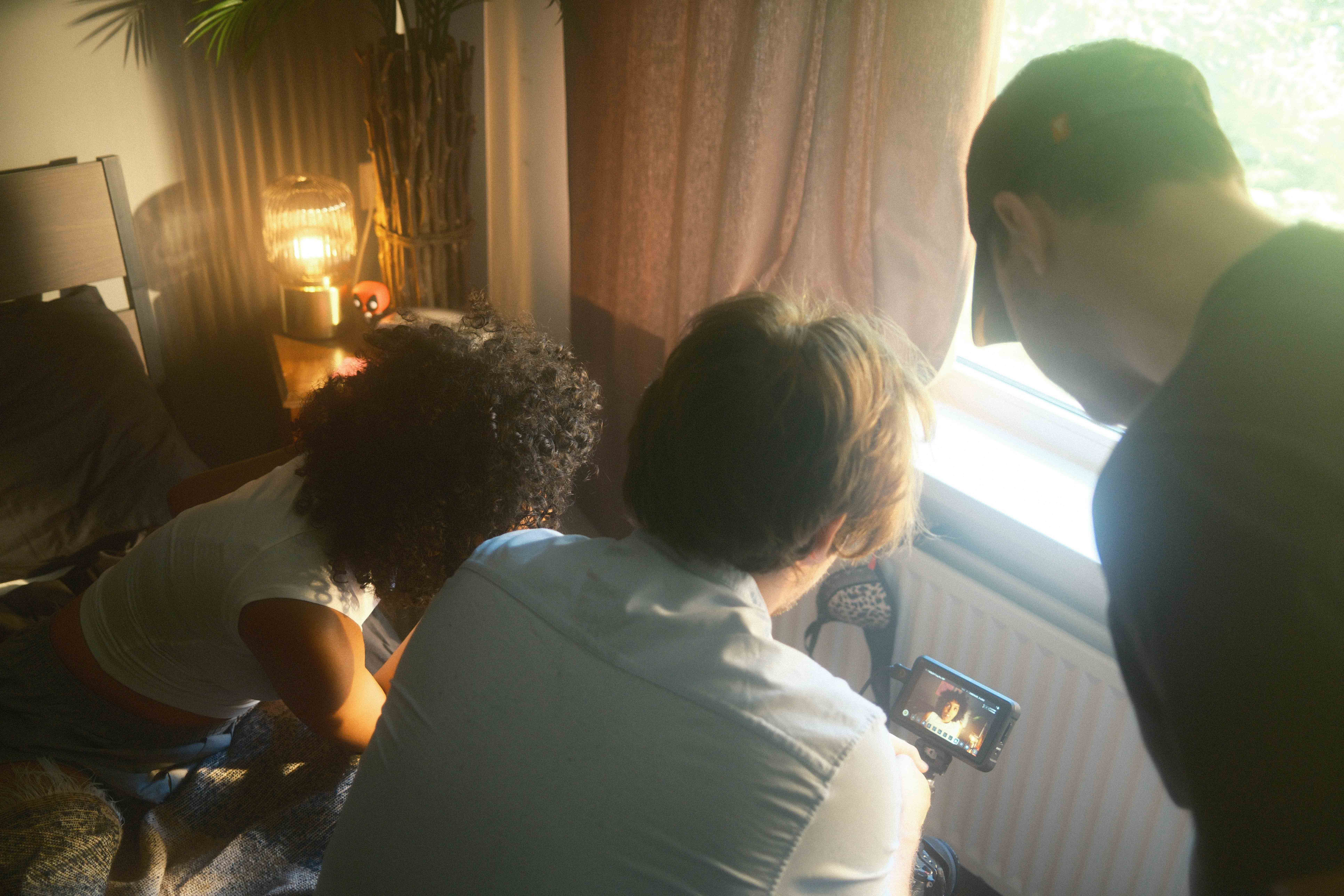 Streetside billboard with flyposters of the Batch.Works brand and illustrations