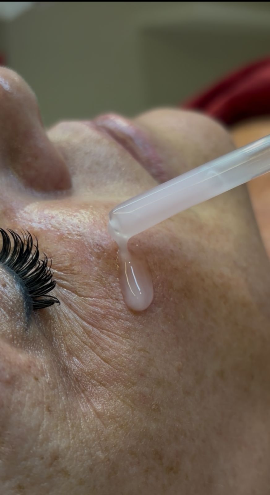 Man applying skincare product to his face