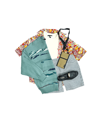 Arrangement of clothes, shoes, and accessories on a black background.