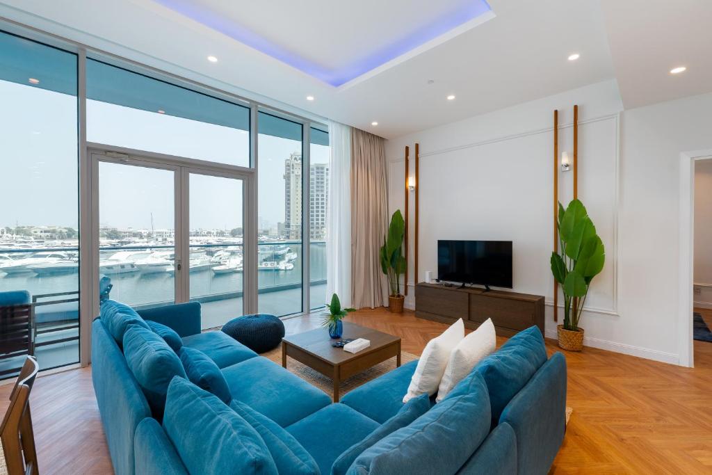 Living room scene with a dining table and chairs, emphasizing the contemporary style of Oceana Residences.