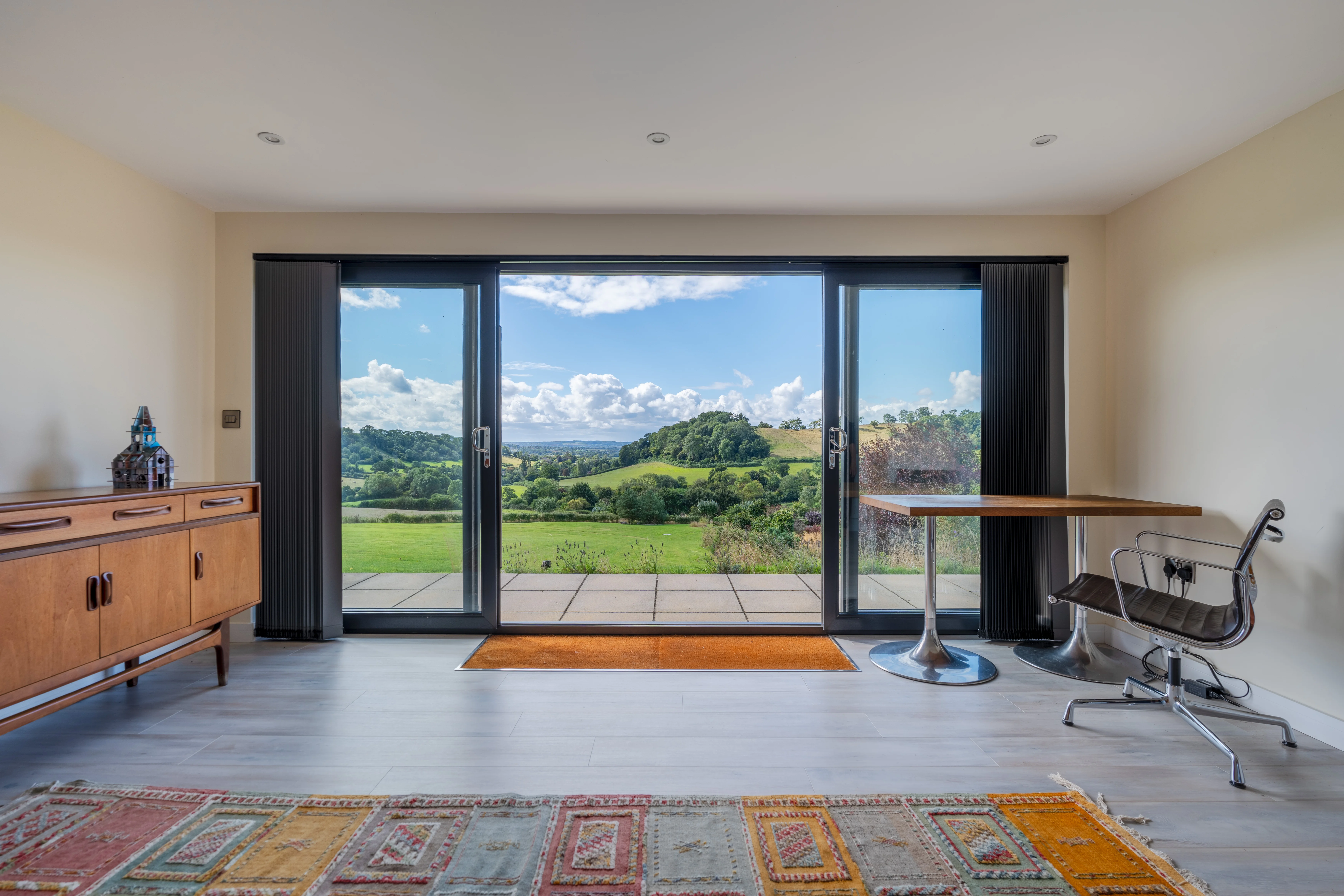 Garden room at Stoodly Barn with full-height glazing and garden outlook