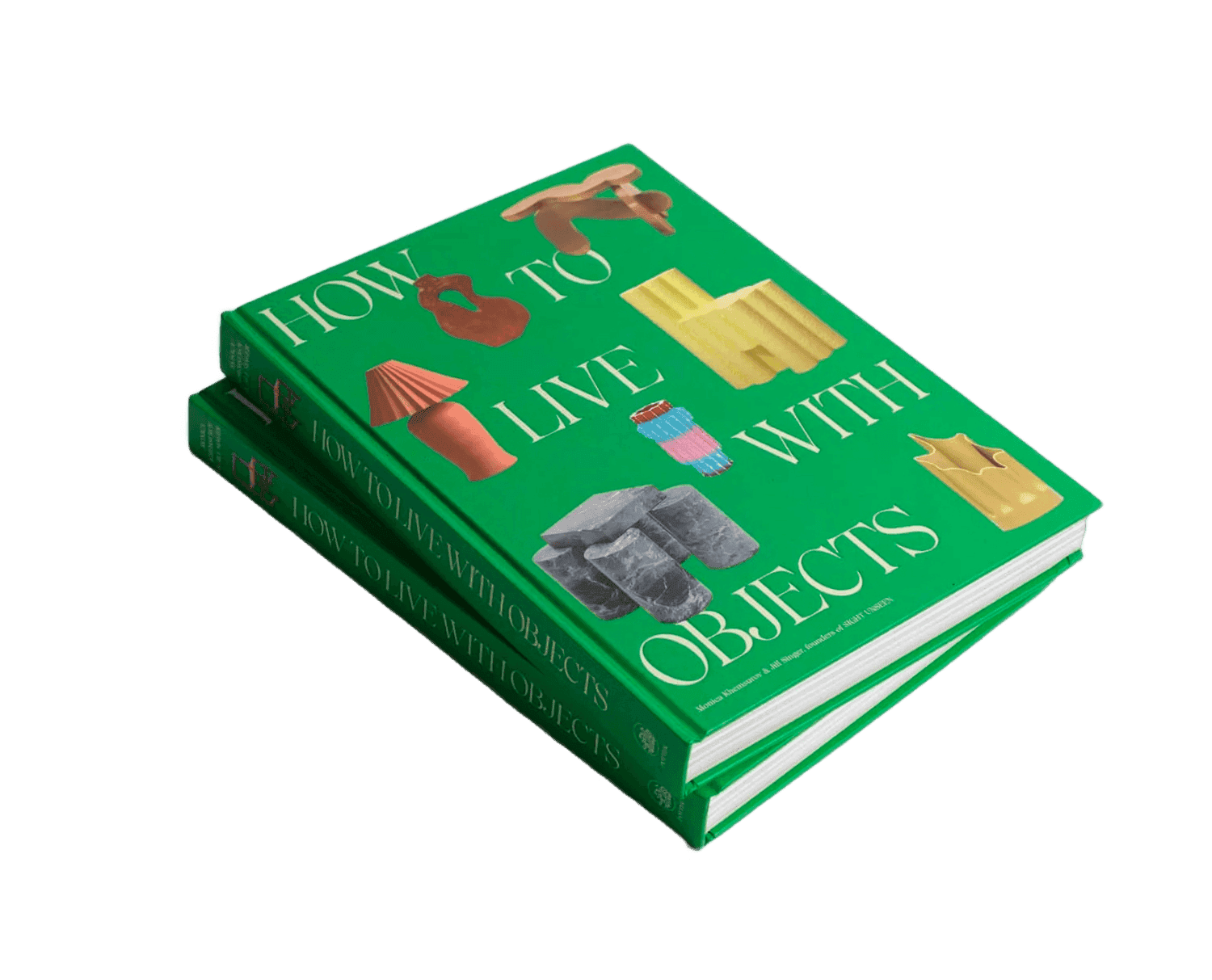 A neatly stacked pair of vibrant green hardcover books titled "How to Live with Objects," featuring an array of illustrated objects on the cover, rests against a plain background.