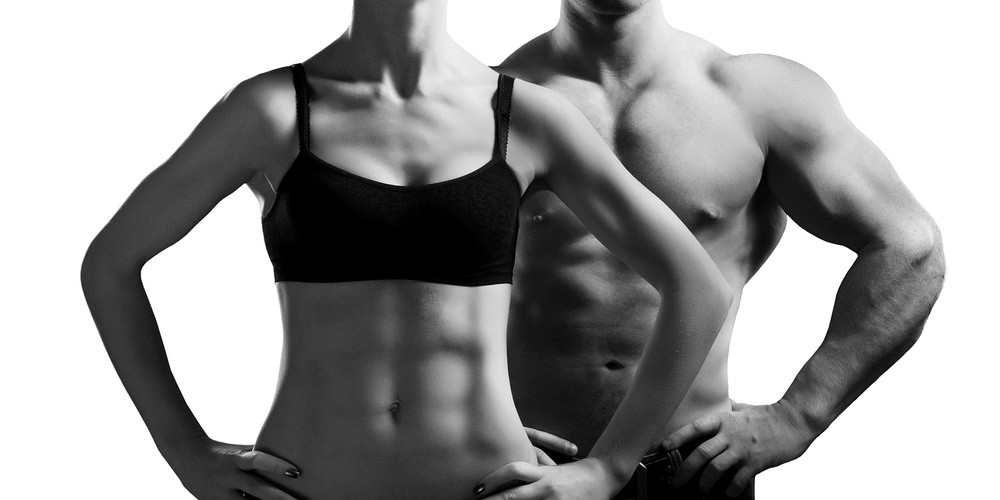 man and woman with ripped abs