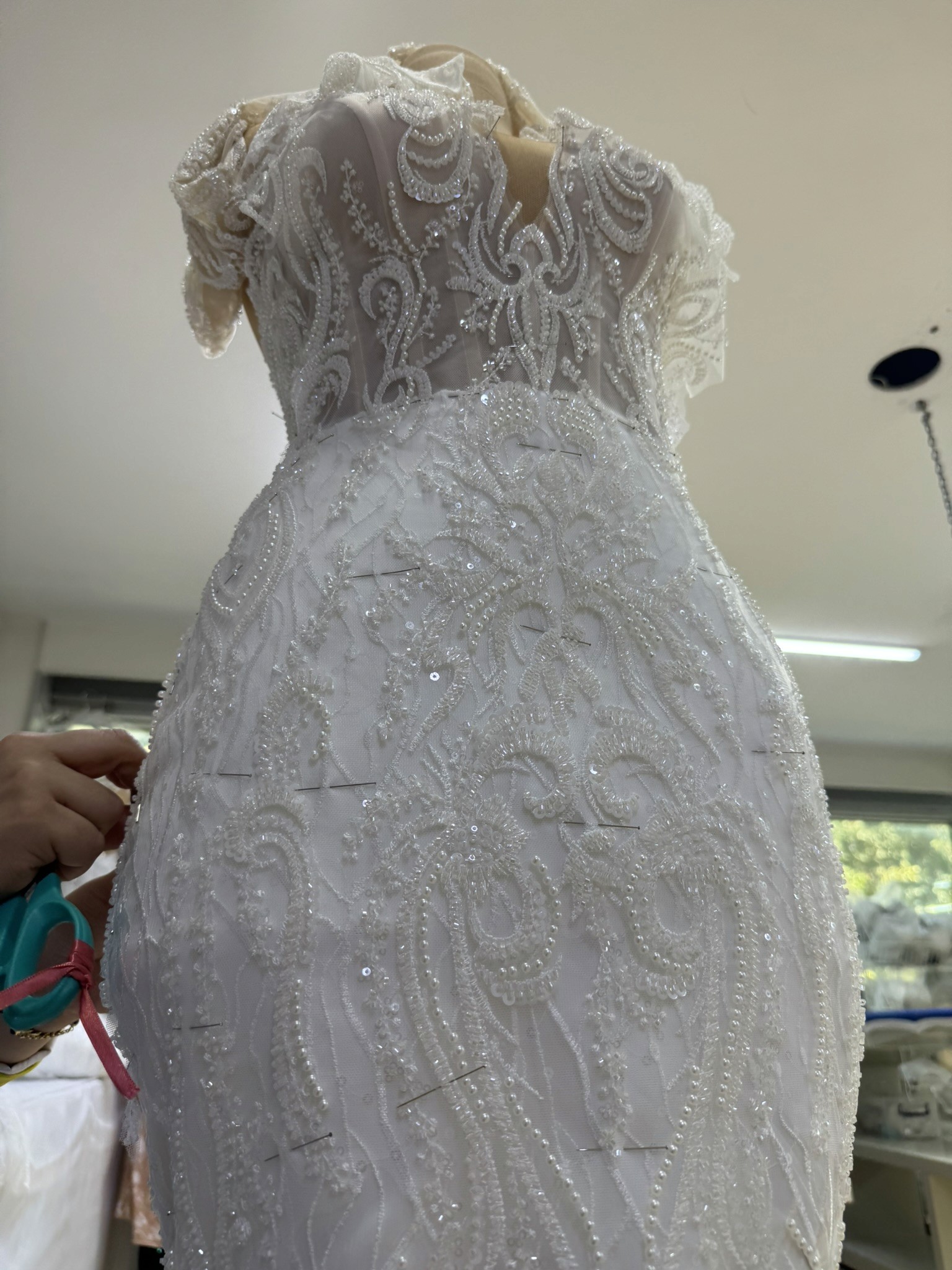 Lucidbride custom wedding dress receiving final quality control in the İzmir atelier