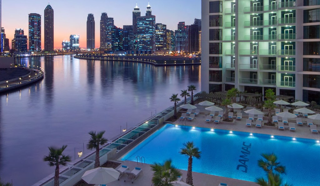 Damac Maison Prive, a contemporary hotel with sleek design, located by the waterfront, showcasing luxury accommodations.
