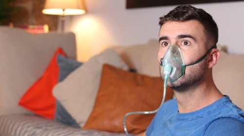 a man wearing a oxygen mask