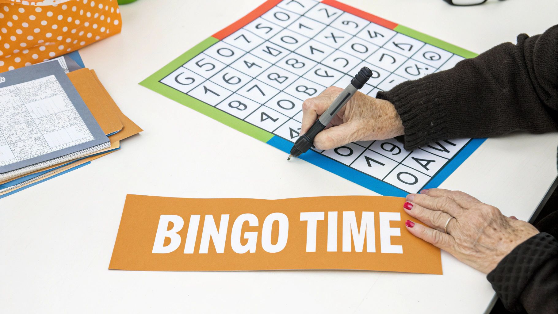 An elderly person's hands mark a bingo card with a pen. An orange sign says 'BINGO TIME'.