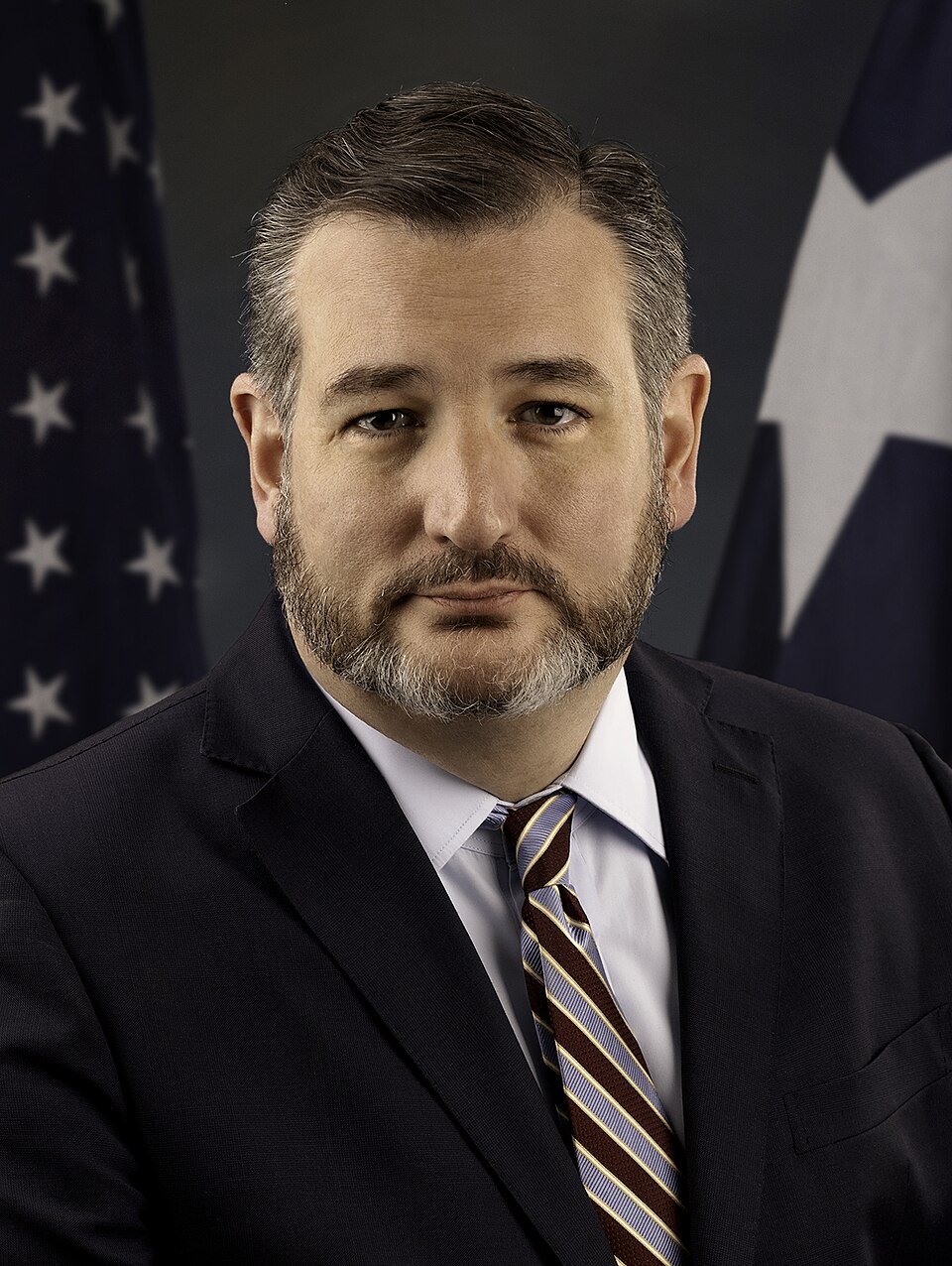 man wearing blue polo shirt with building background